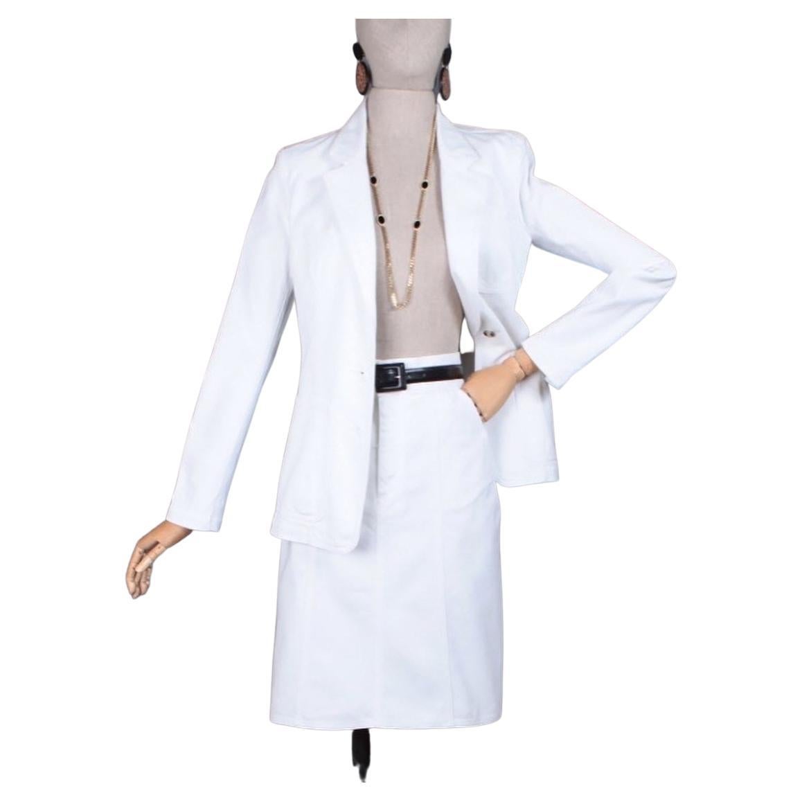 This chic and timeless white Yves Saint Laurent Rive Gauche suit would be perfect for a courthouse wedding, honeymoon, or any occasion at all. Appears to have never been worn. (Belt just to show style, not included.) Made in Italy. White blazer is