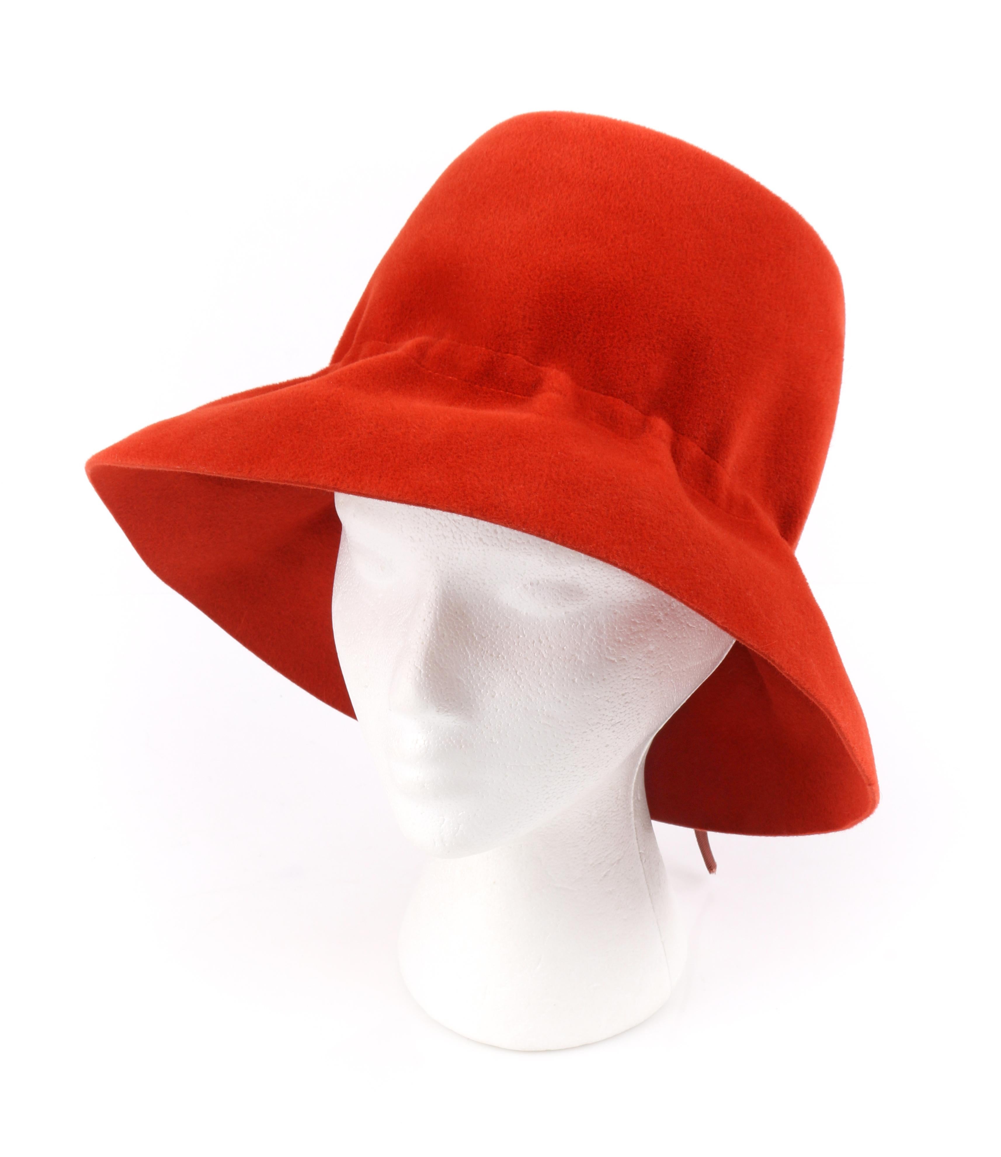 YVES SAINT LAURENT c.1960’s YSL Cayenne Red Felted Fur Structured Bucket Hat
 
Circa: 1960’s
Label(s): Yves Saint Laurent / Paris - New York / Luxuria Imported Body Made In Italy
Style: Bucket Hat
Color(s): Red and brown
Lined: No 
Unmarked Fabric