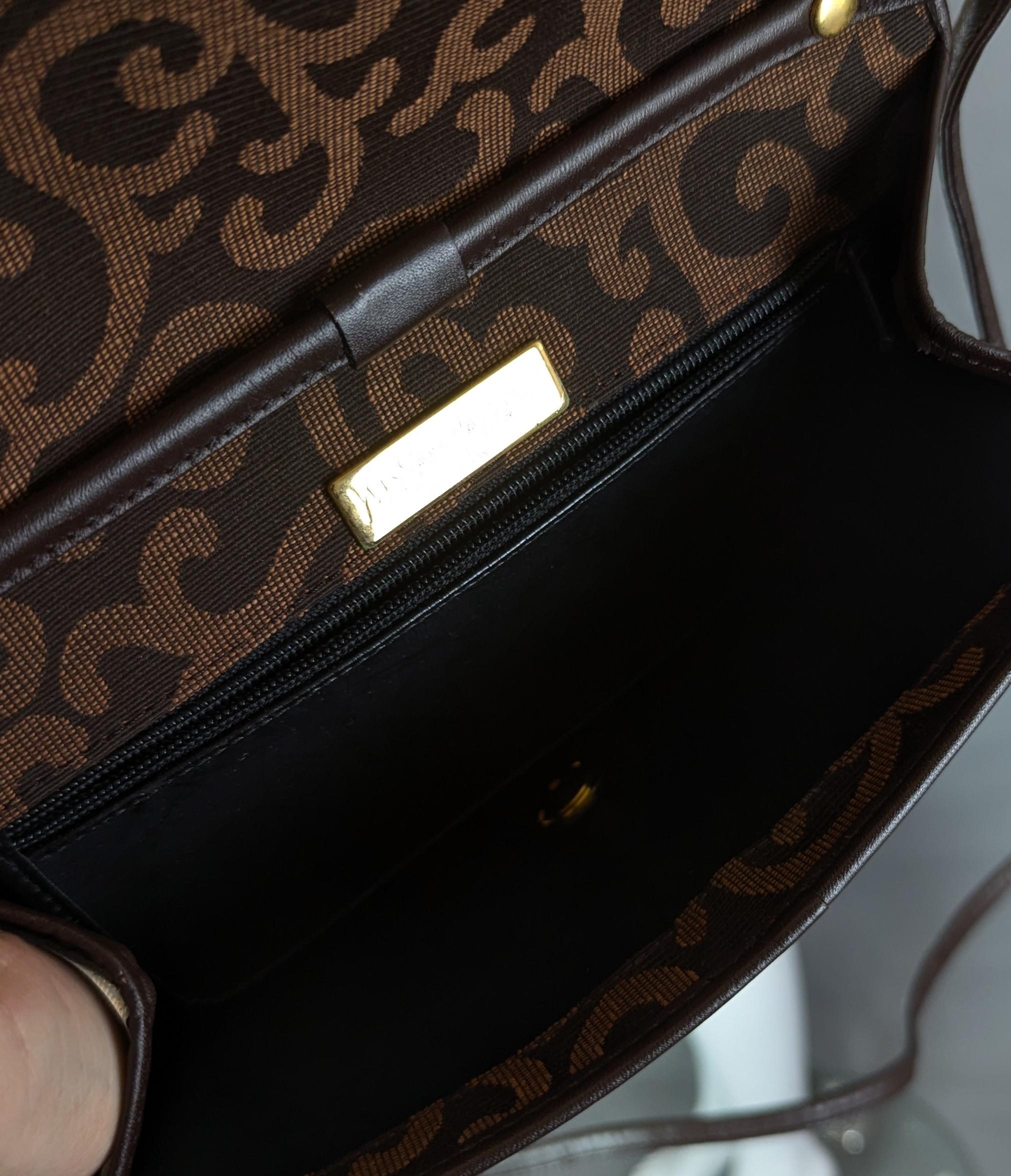 Femenino o masculino Bolso bandolera de lona Yves Saint Laurent, corazón dorado en venta