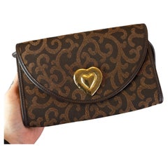 Bolso bandolera de lona Yves Saint Laurent, corazón dorado