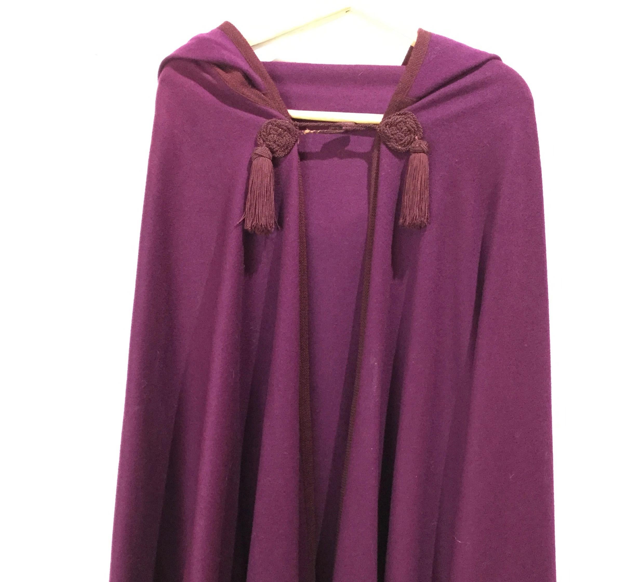Rare Yves Saint Laurent hooded cape in aubergine / burgundy color from the Russian Collection, 1976.
Yves Saint Laurent was inspired by the Russian Ballet and Opera, Leon Bakst