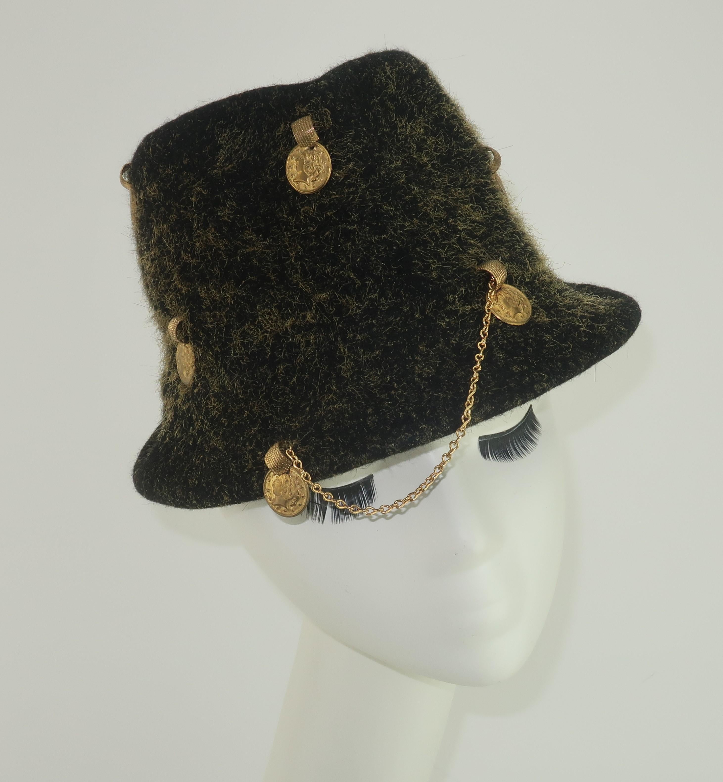 Funky and fabulous 1960's Yves Saint Laurent trilby style hat in a charcoal gray wool with mustard yellow flecks.  The hat is scattered with gold coins attached by coordinating rings and unexpectedly accented by a gold chain at the front brim.  Fun