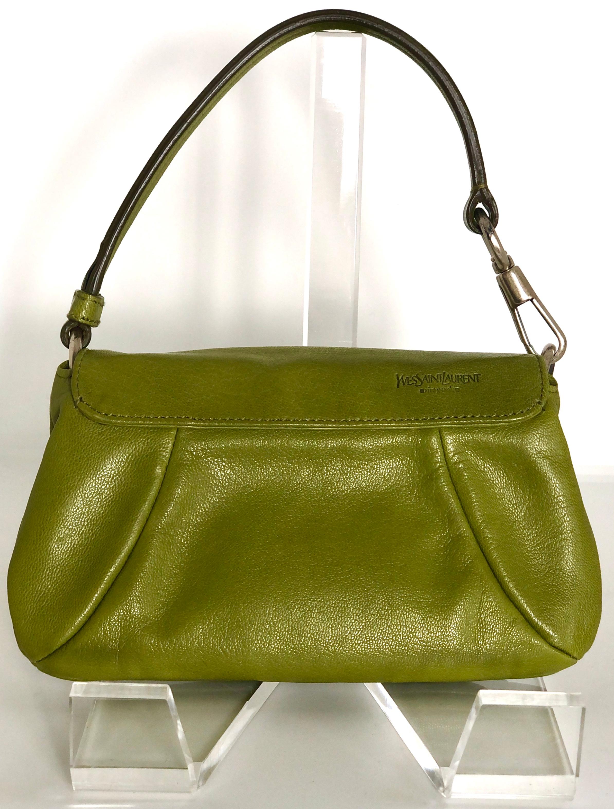 Offered is a signed Yves Saint Laurent chartreuse green leather floral ruffle theme mini shoulder 
bag, wristlet, clutch or top handle handbag.  

Make:  Yves Saint Laurent / YSL
Place of Manufacture:  France / Italy
Color:  Chartreuse green
