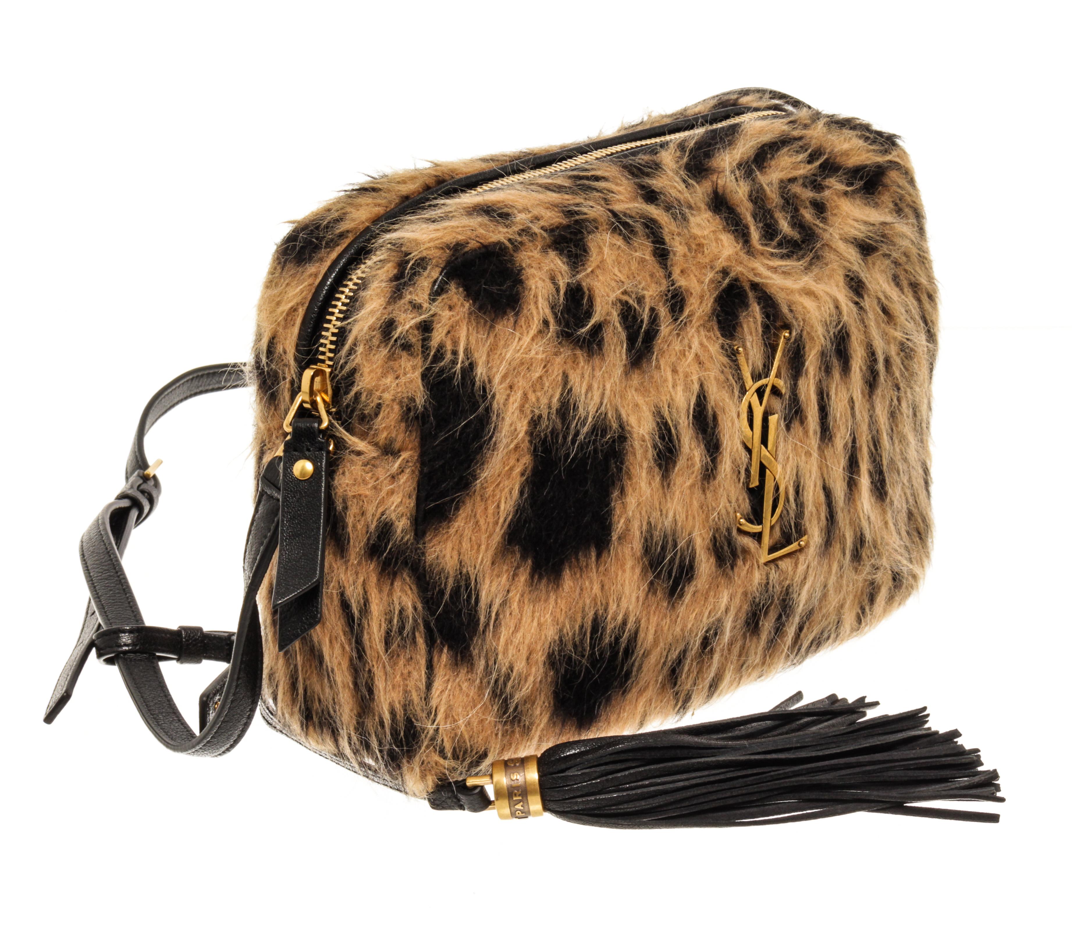 Yves Saint Laurent Cheetah Print Camera Bag with adjustable strap, zipper closure and fabric lining.

49347MSC