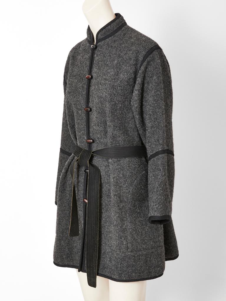 Yves Saint Laurent, Rive Gauche, charcoal grey,  wool, Chinese collection belted jacket, having a Mandarin collar, black braided trim, horn buttons, and a ribbed suede belt.
