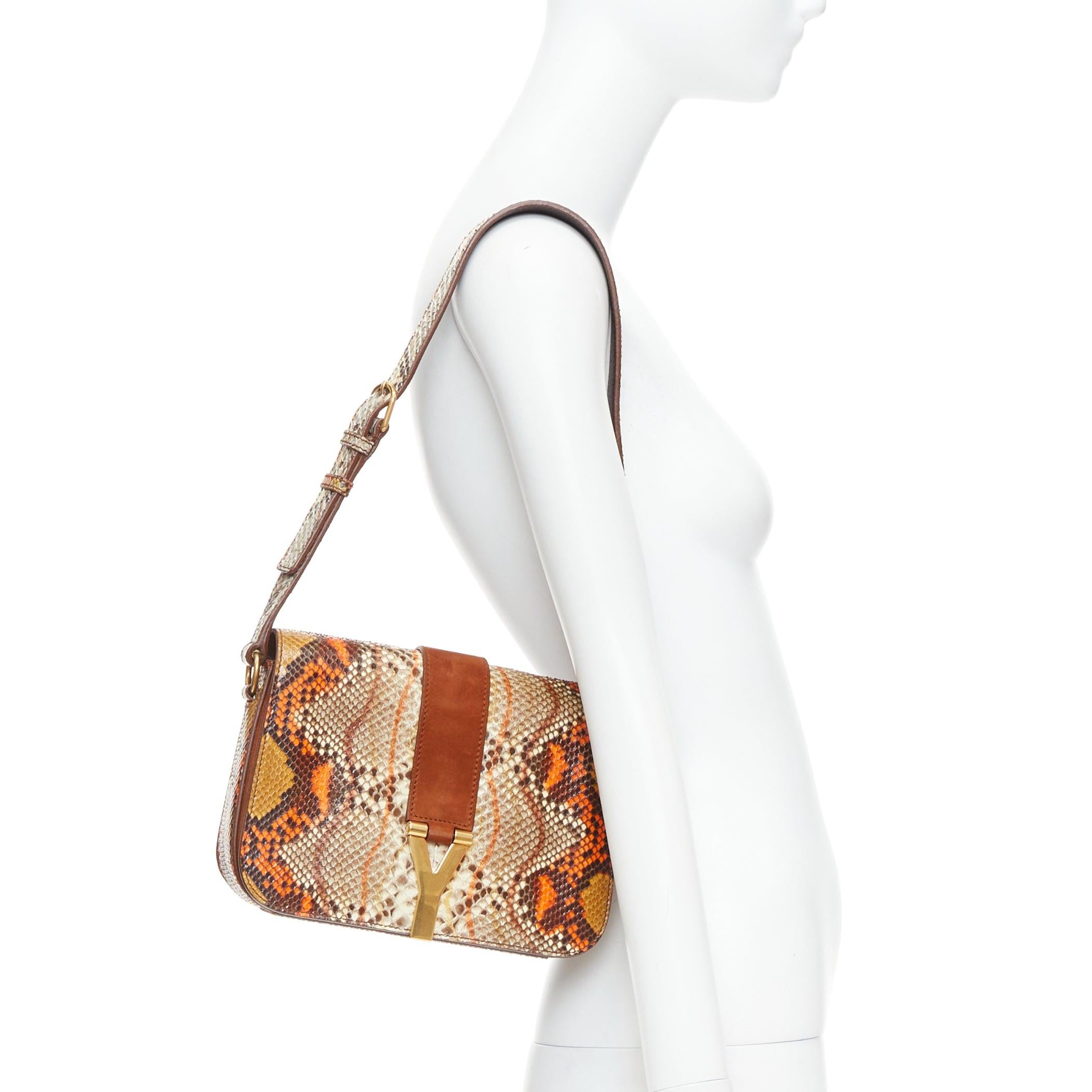 YVES SAINT LAURENT Chyc orange brown scaled leather flap crossbody bag
Reference: TGAS/E00603
Brand: Yves Saint Laurent
Model: Chyc
Material: Leather
Color: Brown, Orange
Pattern: Animal Print
Closure: Snap Buttons
Lining: Brown Suede
Extra Details: