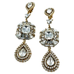 Yves Saint Laurent clip-on earring, gold metal, rhinestone in jewelry style 1985