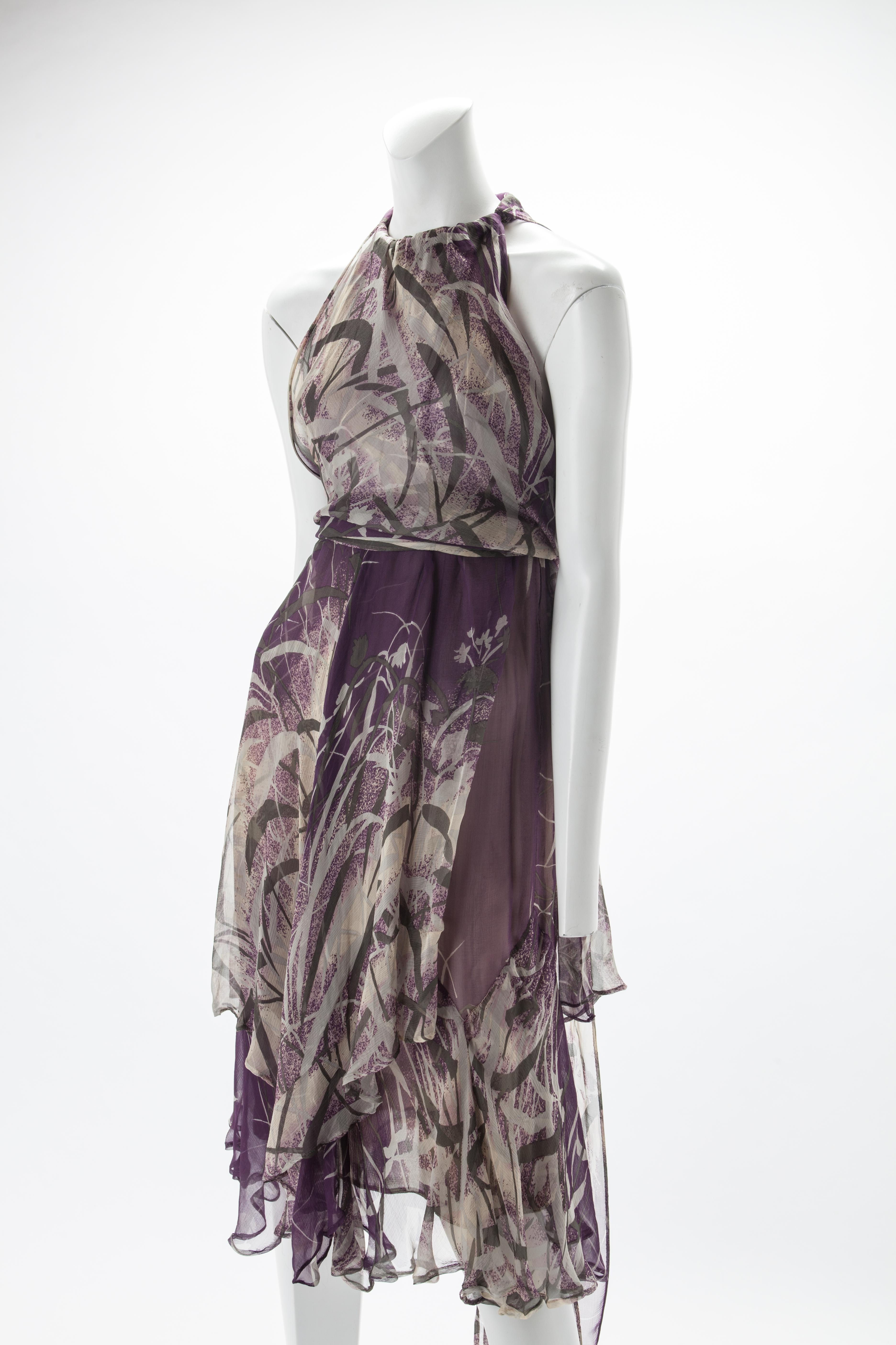 Yves Saint Laurent Couture Foliage Printed Silk Chiffon Cocktail Dress, c.1970s.
Gathered halter neck with self tie belt at waist able to be tied at the back, side, or front. 
Multiple tiered silk chiffon layers with circular flounce hem lines.