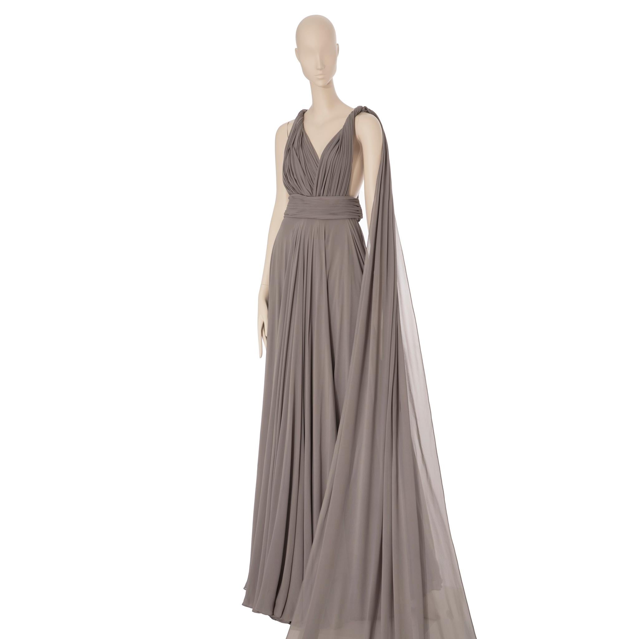 This stunning Yves Saint Laurent grey evening dress is designed from luxurious couture fabric for a timelessly elegant look. Crafted with precision and attention to detail, you can be sure this garment will turn heads. Ideal for special occasions,