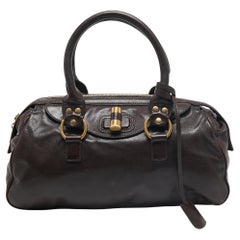 Yves Saint Laurent Dunkelbraune Muse Bowlertasche aus Leder