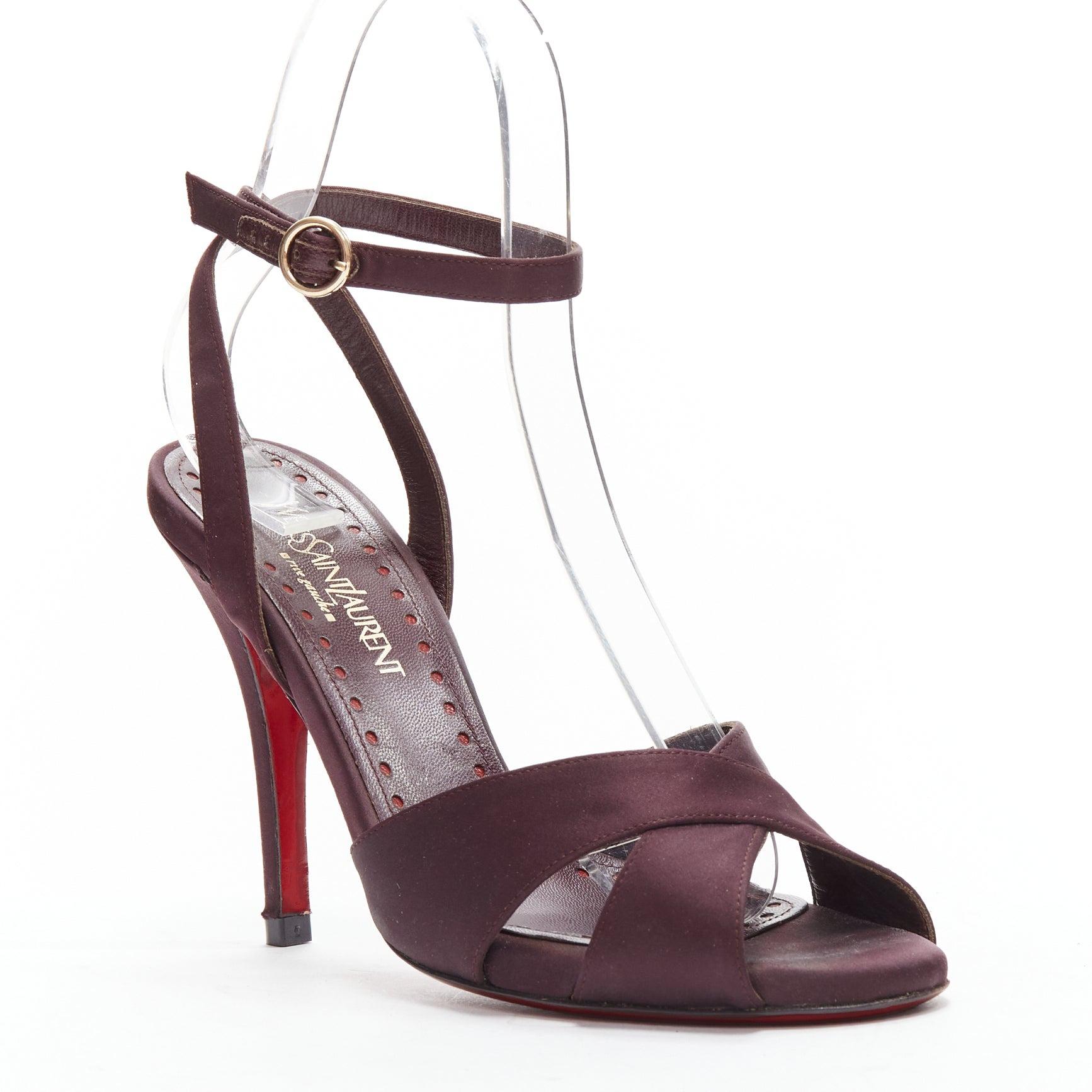 YVES SAINT LAURENT dark purple satin red sole sandal heels EU38
Reference: GIYG/A00376
Brand: Yves Saint Laurent
Material: Satin
Color: Purple
Pattern: Solid
Closure: Ankle Strap
Lining: Burgundy Leather
Extra Details: Red sole design
Made in: