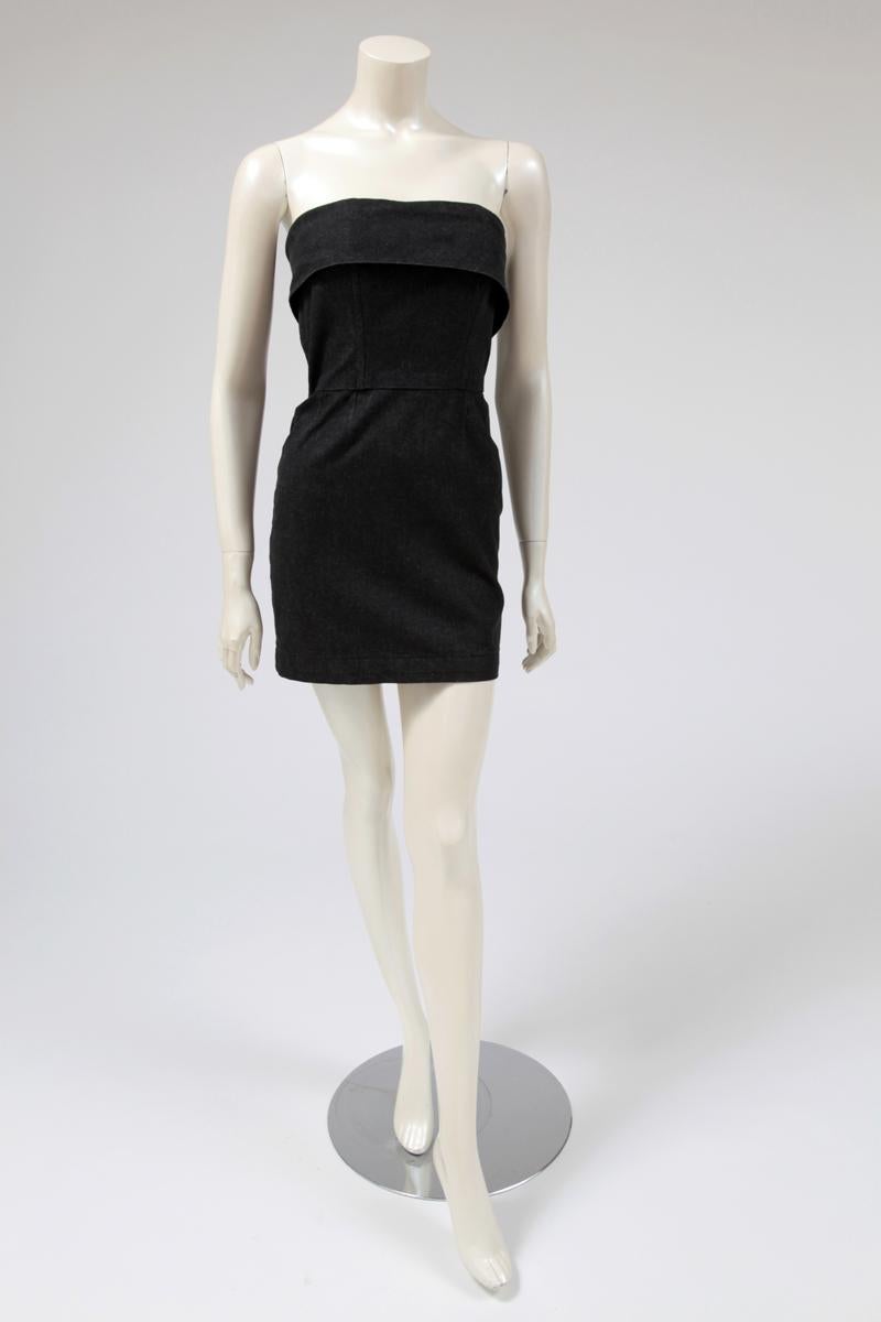 80’s runway black denim mini dress with flattering fold-over cuff on top of the bodice. Fully boned “corset” structure that gives a sexy-ladylike impression. Seven large buttons in the back close the dress. 

Fits approx. : US 0-4 (small US 4) / FR