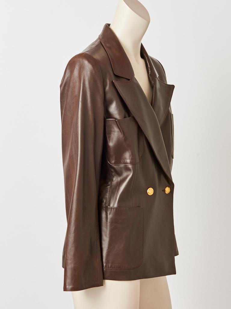 Yves Saint Laurent, Rive Gauche, chocolate brown, double breasted, leather Blazer having wide notched lapels and deep patch pockets. Gold button closures.