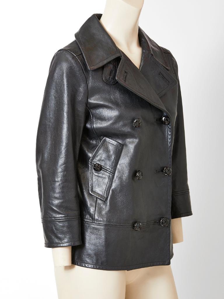 Yves Saint Laurent Rive Gauche, black leather, double breasted, Pea Jacket, having oversized lapels, top stitching detail and slanted, side flap pockets. Sleeve length is slightly cropped.