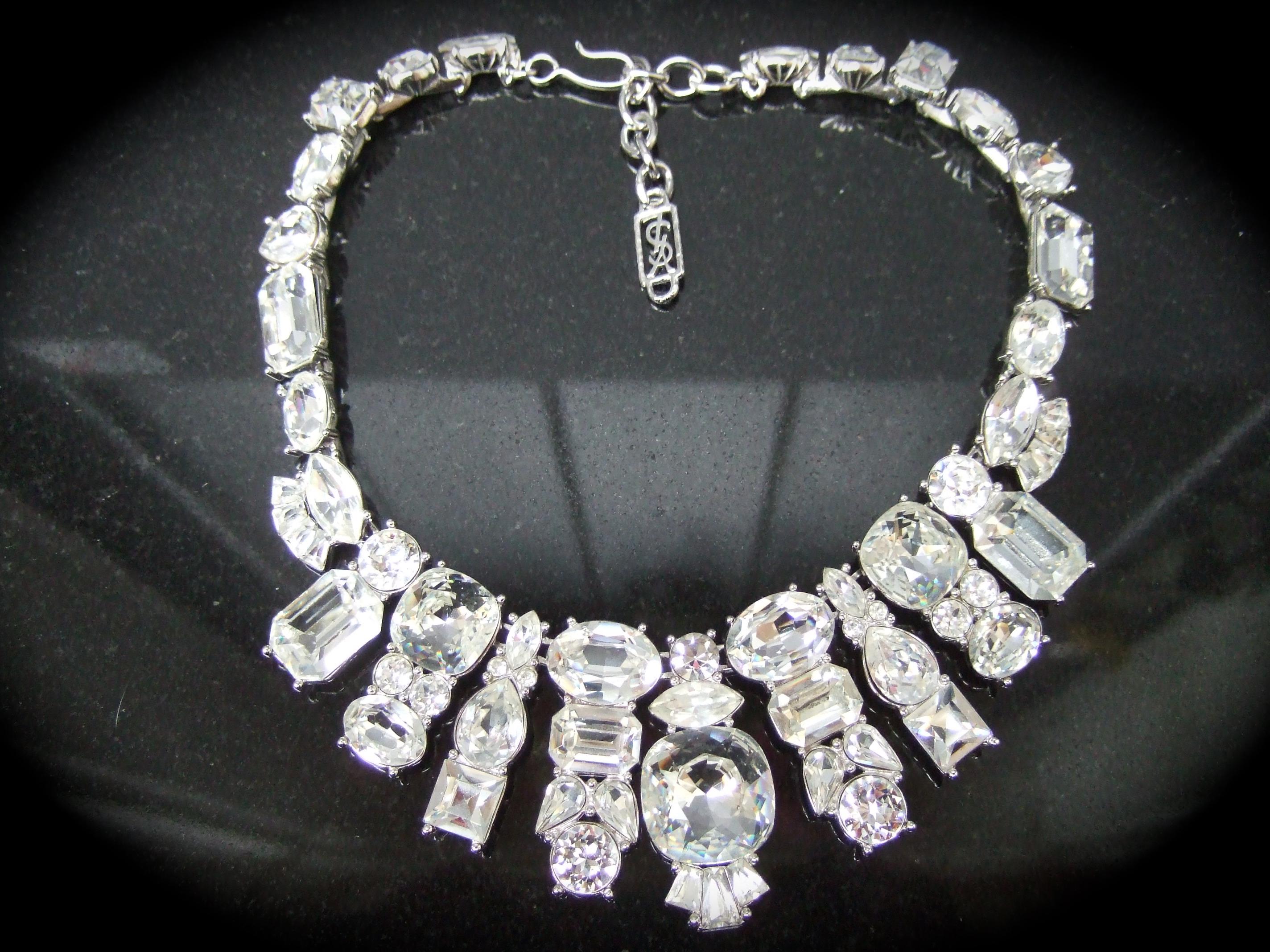 YVES SAINT LAURENT Dramatic eye-catching glittering crystal statement necklace c 1980s
Embellished with a collection of chunky brilliant clear diamante crystals in a myriad of sizes & shapes 
The choker style necklace has a solid  substantial weight
