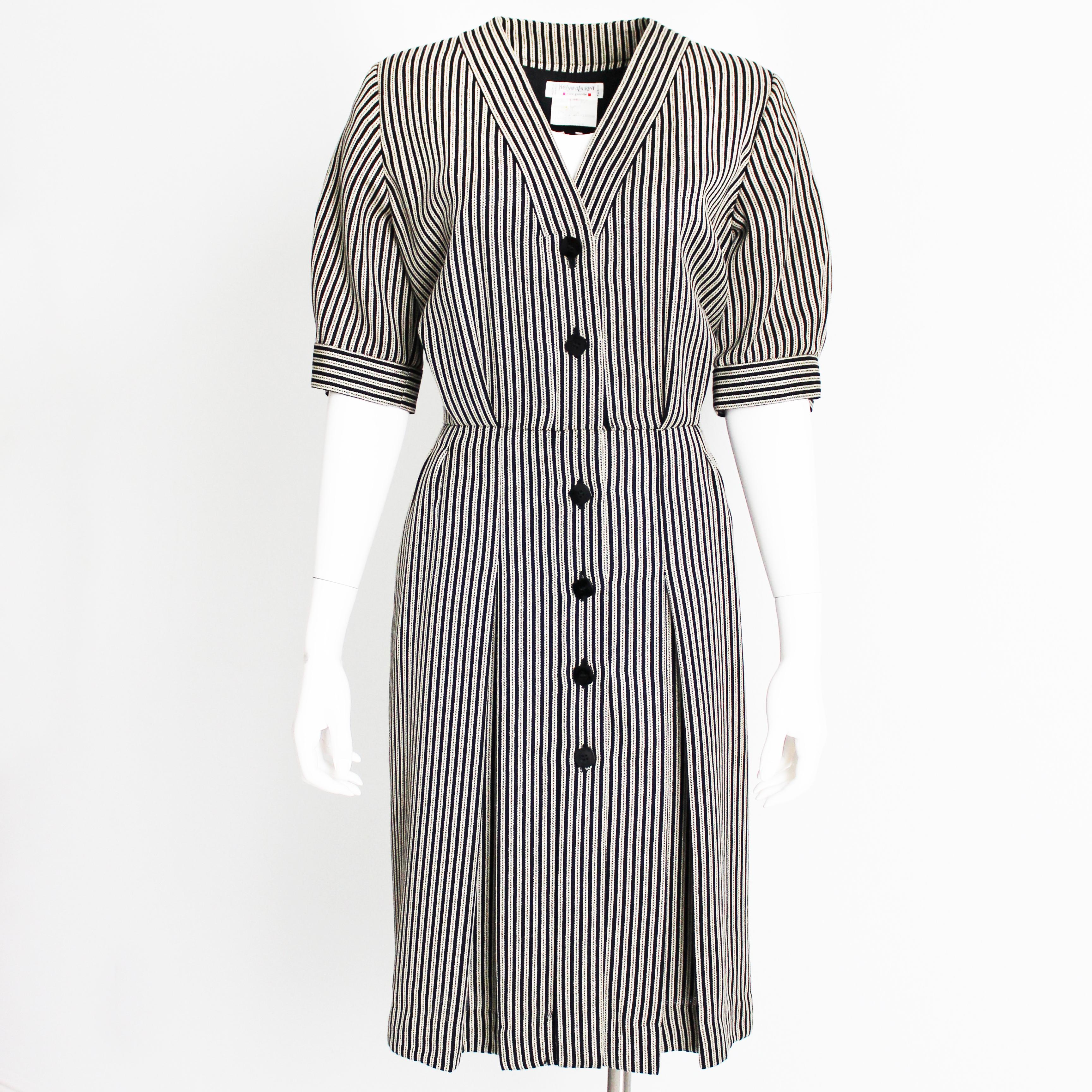 Authentic, preowned, vintage Yves Saint Laurent Rive Gauche pinstripe dress, likely made in the 1990s.  Made from a wool/silk/rayon blend woven pinstripe fabric, it features button-front styling, a cinched waist, slash pockets at the hips and pretty