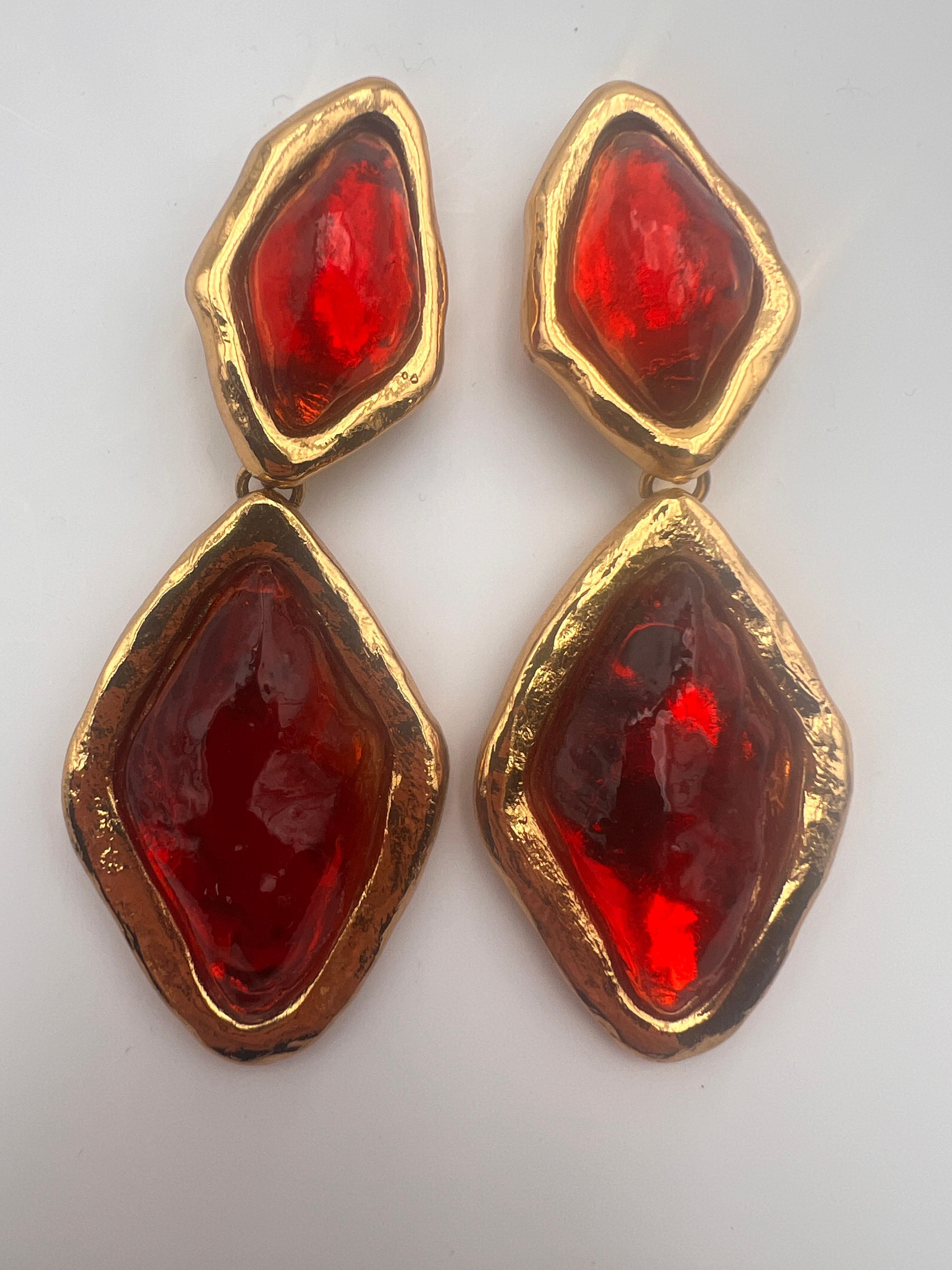 Timeless Yves saint Laurent earrings create by Robert Gossens . Gold plate red cabochon. Stamp on the back and on the clip.
Yves saint Laurent Made in France