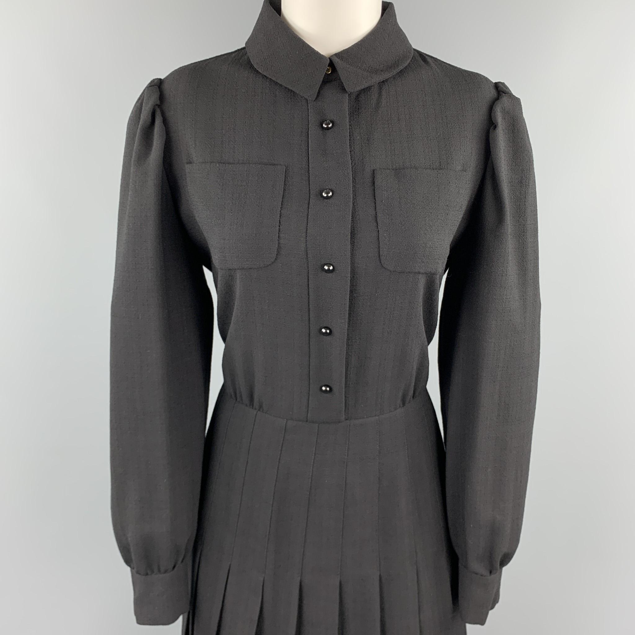 YVES SAINT LAURENT EDITION 24 shirt dress comes in black wool crepe with a pointed collar, puff sleeve, patch pocket blouse top and box pleated skirt bottom. 

Excellent Pre-Owned Condition.
Marked: EU 44

Measurements:

Shoulder: 15.5 in.
Bust: 42