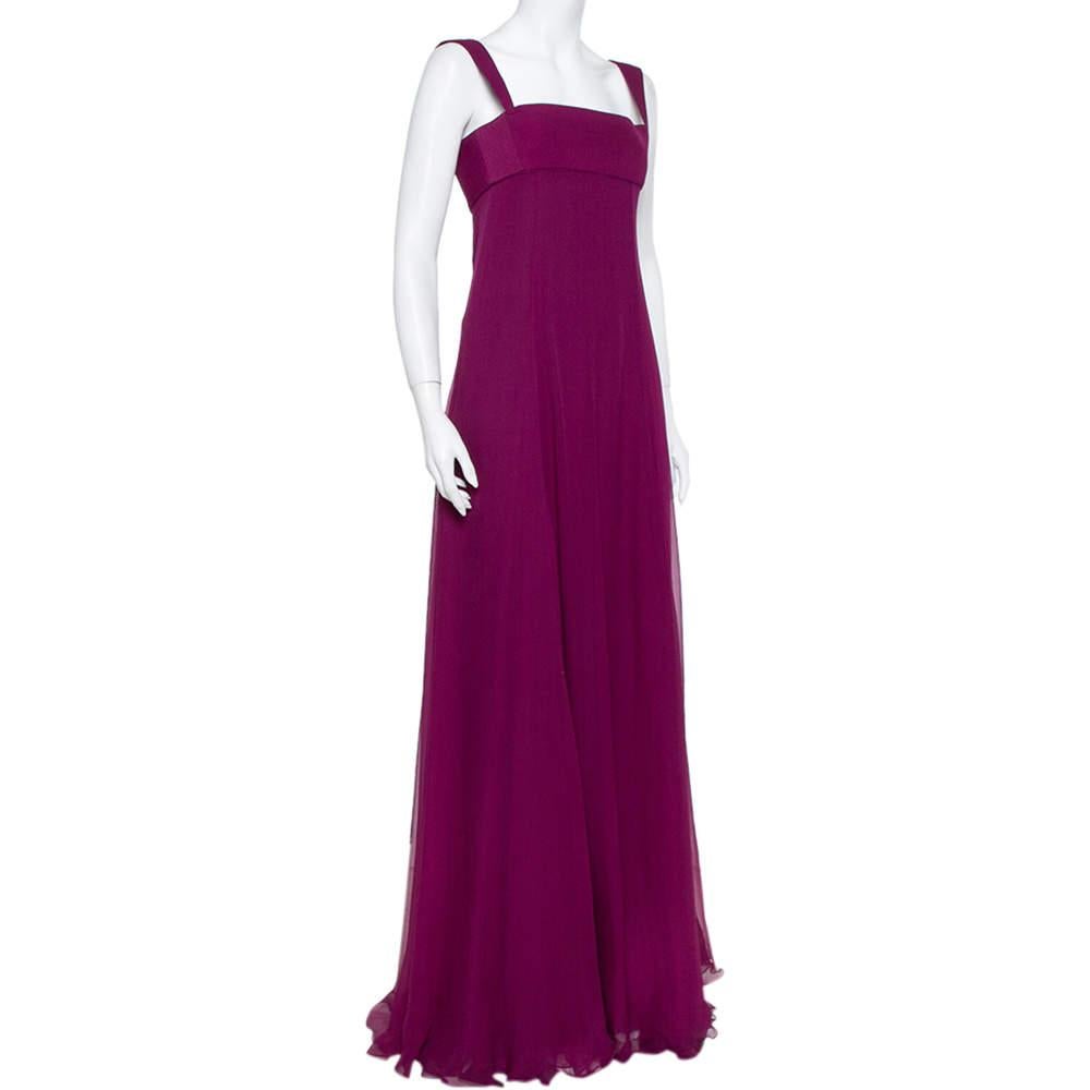 You will love the way you look when you slip this gown on. It is a design by Yves Saint Laurent, wonderfully tailored from silk and designed with a square-cut neckline, and a simple yet sophisticated silhouette complemented by a floor-length