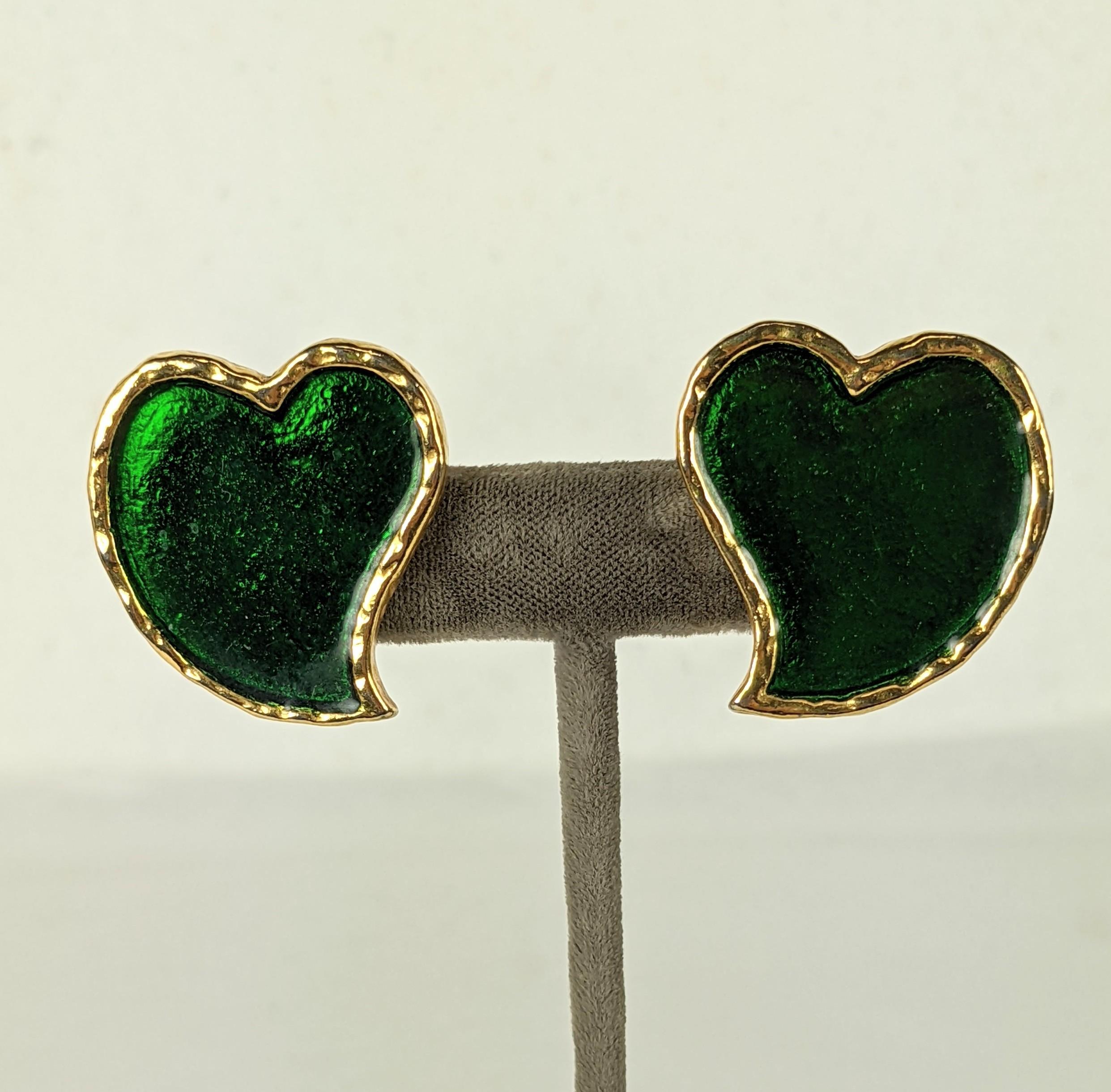 Yves Saint Laurent Iconic Enamel Heart Earrings from the 1980's. Rich emerald green enamel decorates the abstract heart shaped forms by Maison Goossens. 1.25