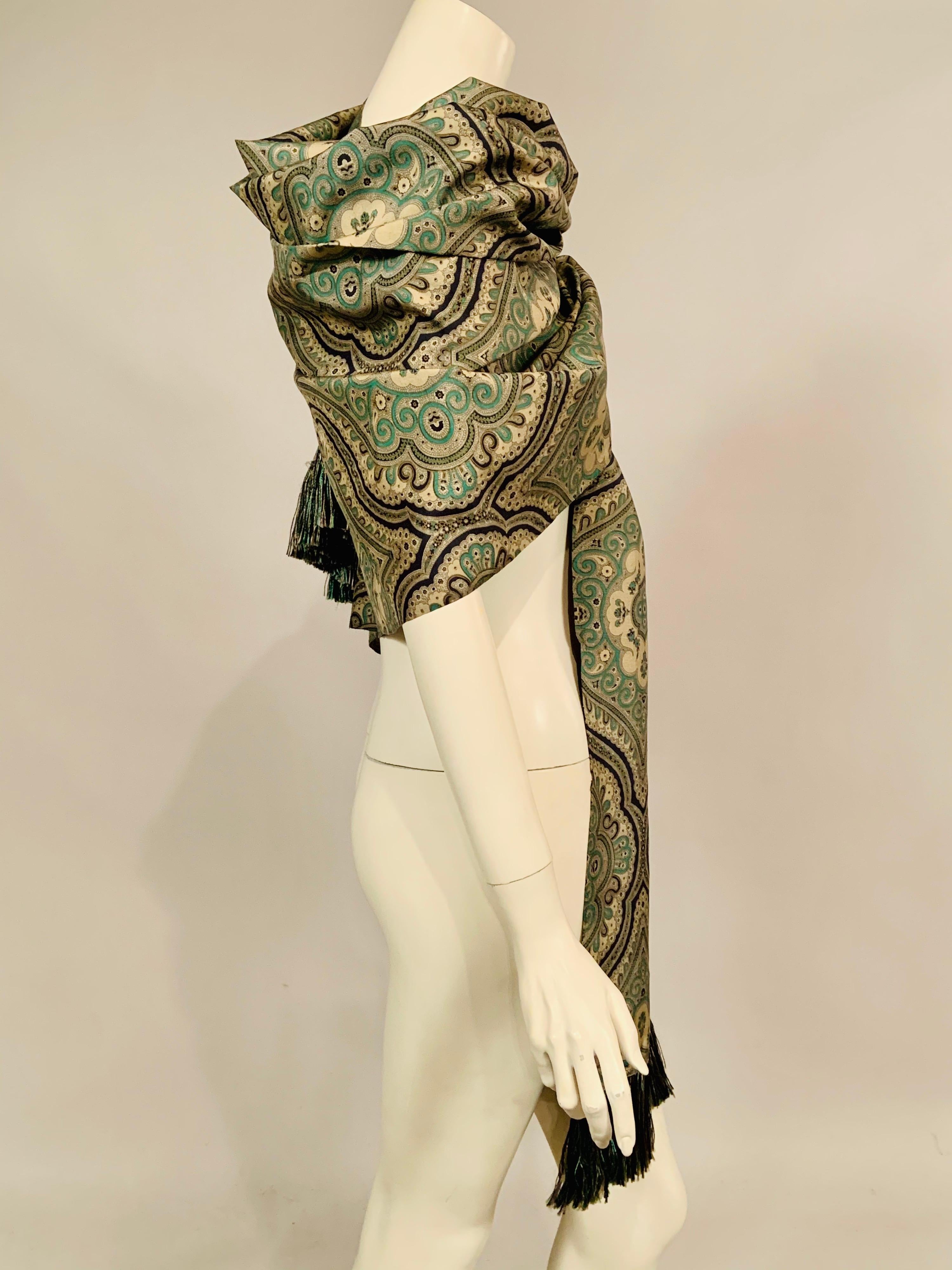 This lovely oversized silk shawl from YSL has a khaki colored background with a black and green design and black, green and khaki silk fringe on both narrow ends.  It appears to have never been worn and it is in excellent condition.
Measurements;  