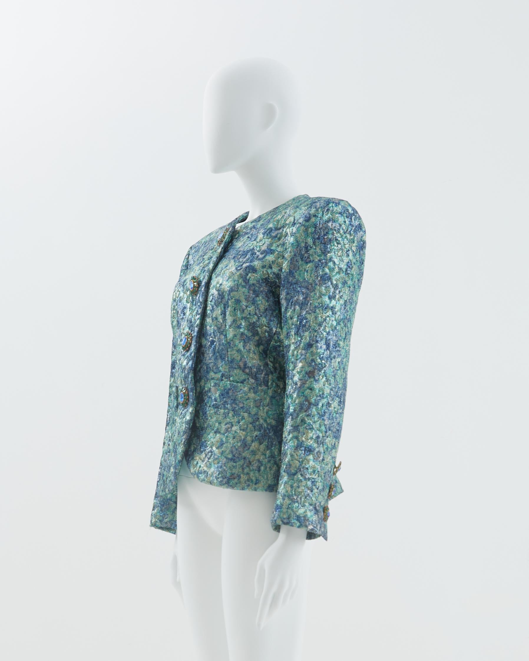 - Yves Saint Laurent Rive Gauche 
- Sold by Skof.Archive
- Blue silk and lurex brocade evening jacket
- Jewel buttons closure 
- Silk satin lining
- Fitted to the body 
- Fall Winter 1991

Size
FR 38 - EN 42 - UK 10 - US 8 (EU)

Measurements
Width