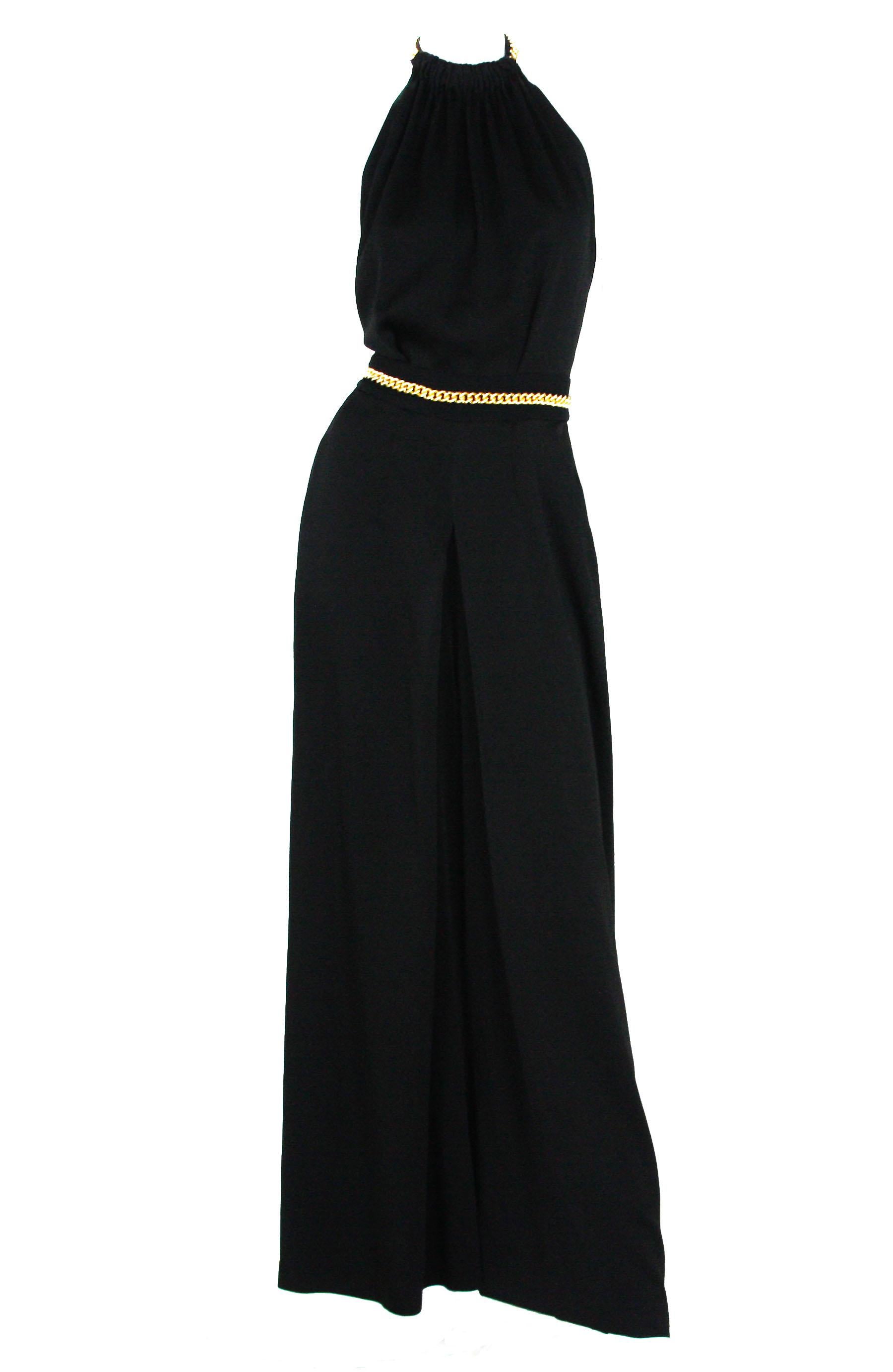 black jumpsuit with gold chain