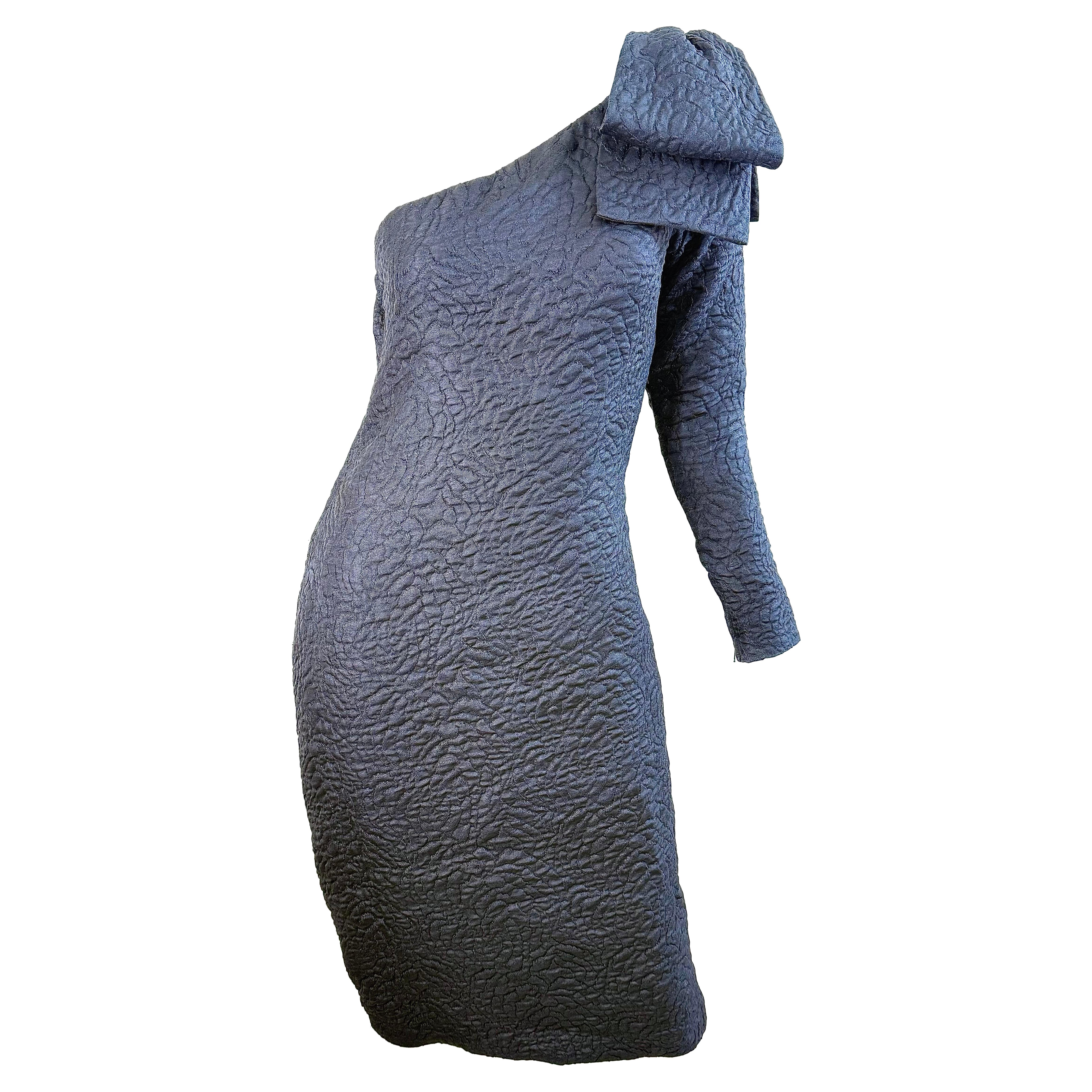 Who designs Yves Saint Laurent menswear?