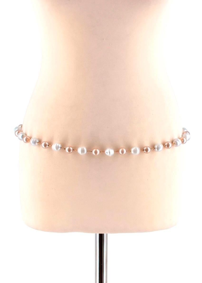 Yves Saint Laurent Faux-Pearl Chain Belt

- Gold hardware around the pearls
- Large faux-pears which look realistic with cream and beige tones
- Hook with adjustable chain to fasten
- Mid weight material
- Perfect for dressing up a black dress or