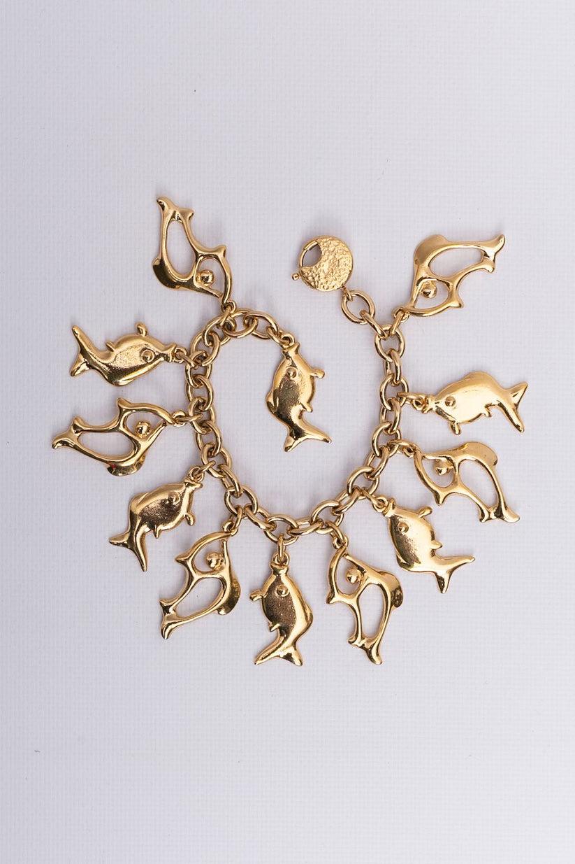 Yves Saint Laurent Bracelet de poissons en métal doré Excellent état - En vente à SAINT-OUEN-SUR-SEINE, FR
