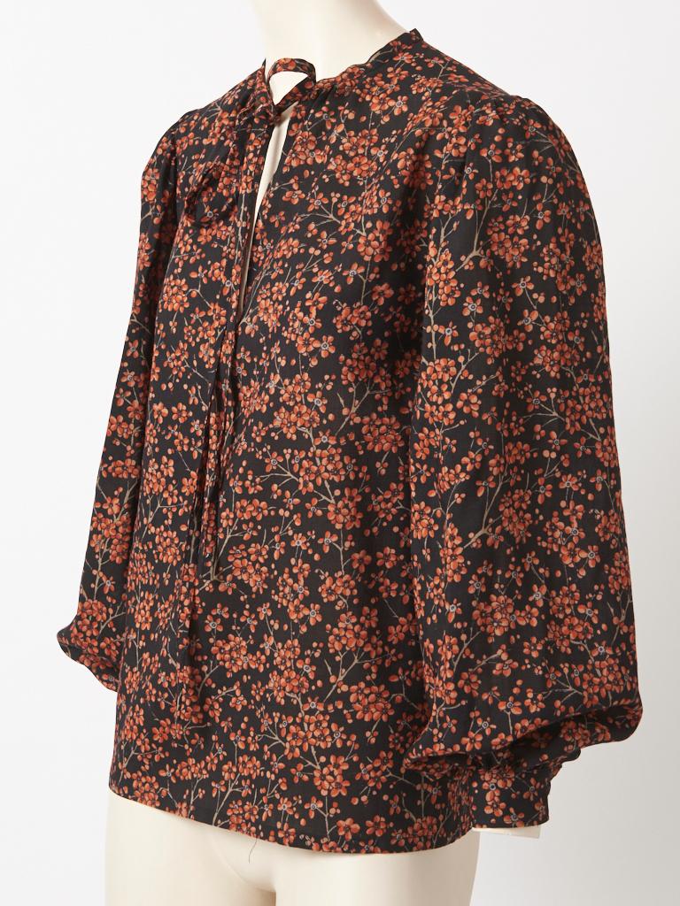 Yves Saint Rive Gauche, wool challis peasant style, late 70's blouse having a delicate floral pattern, on a black ground.