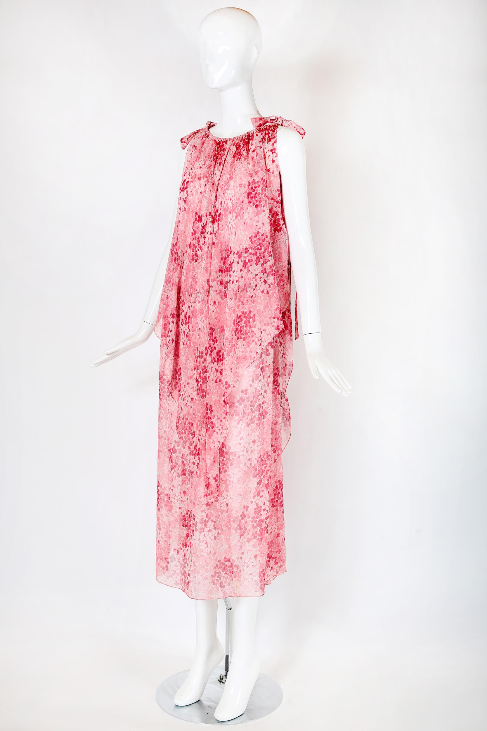 Vintage Yves Saint Laurent pink floral printed chiffon double-layered sleeveless tunic-style dress with an elastic waistband at the interior tunic dress, a gathered elastic neckline, a slit up the left side and extra long fabric ties at each