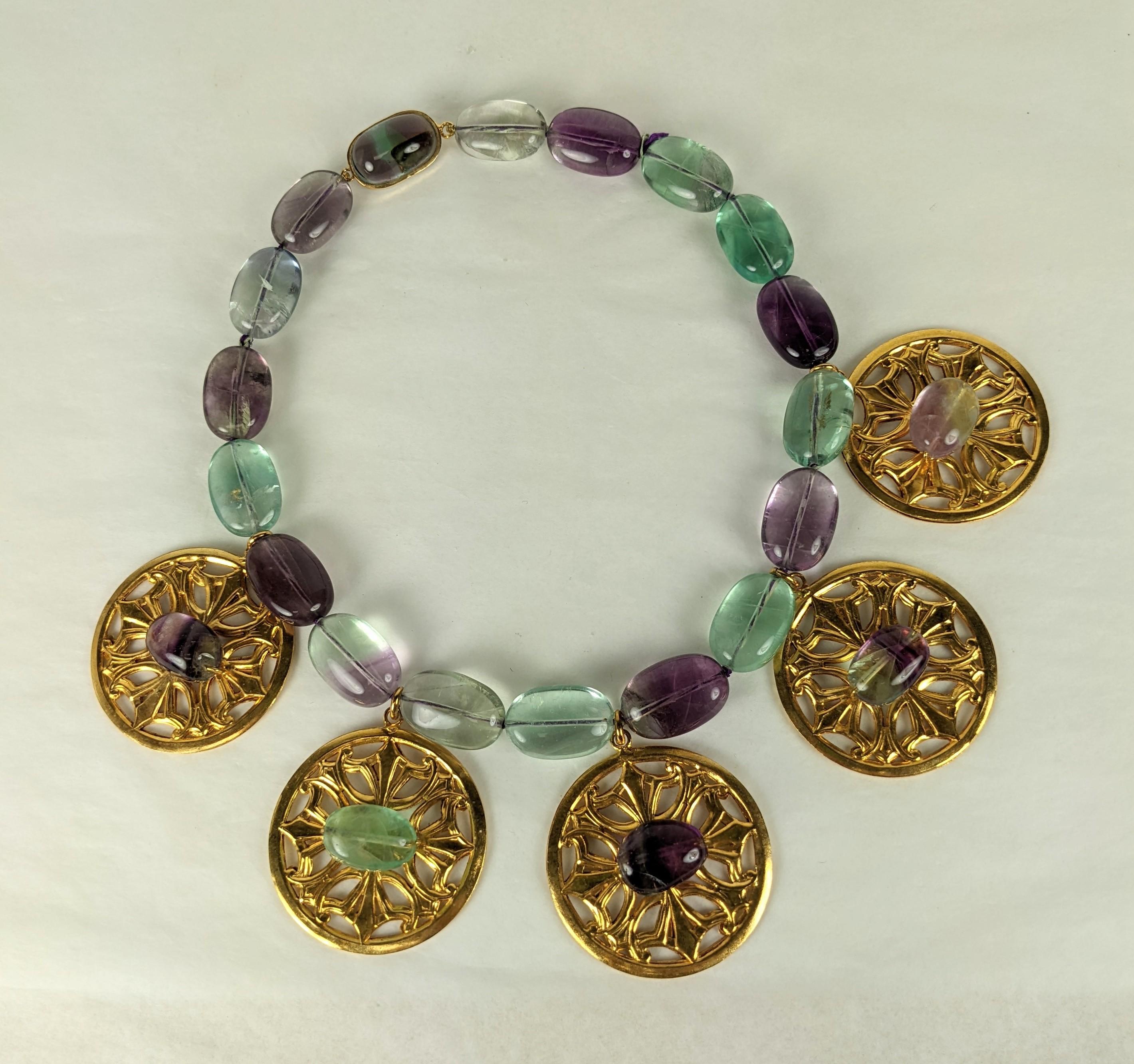 Amazing Yves Saint Laurent Fluorite and Gilt Bronze Necklace, Maison Goossens. Unusual gilt bronze discs are set with natural fluorite beads and hang from a strand of hand knotted fluorite beads. The clasp is highly unusual as the poured glass