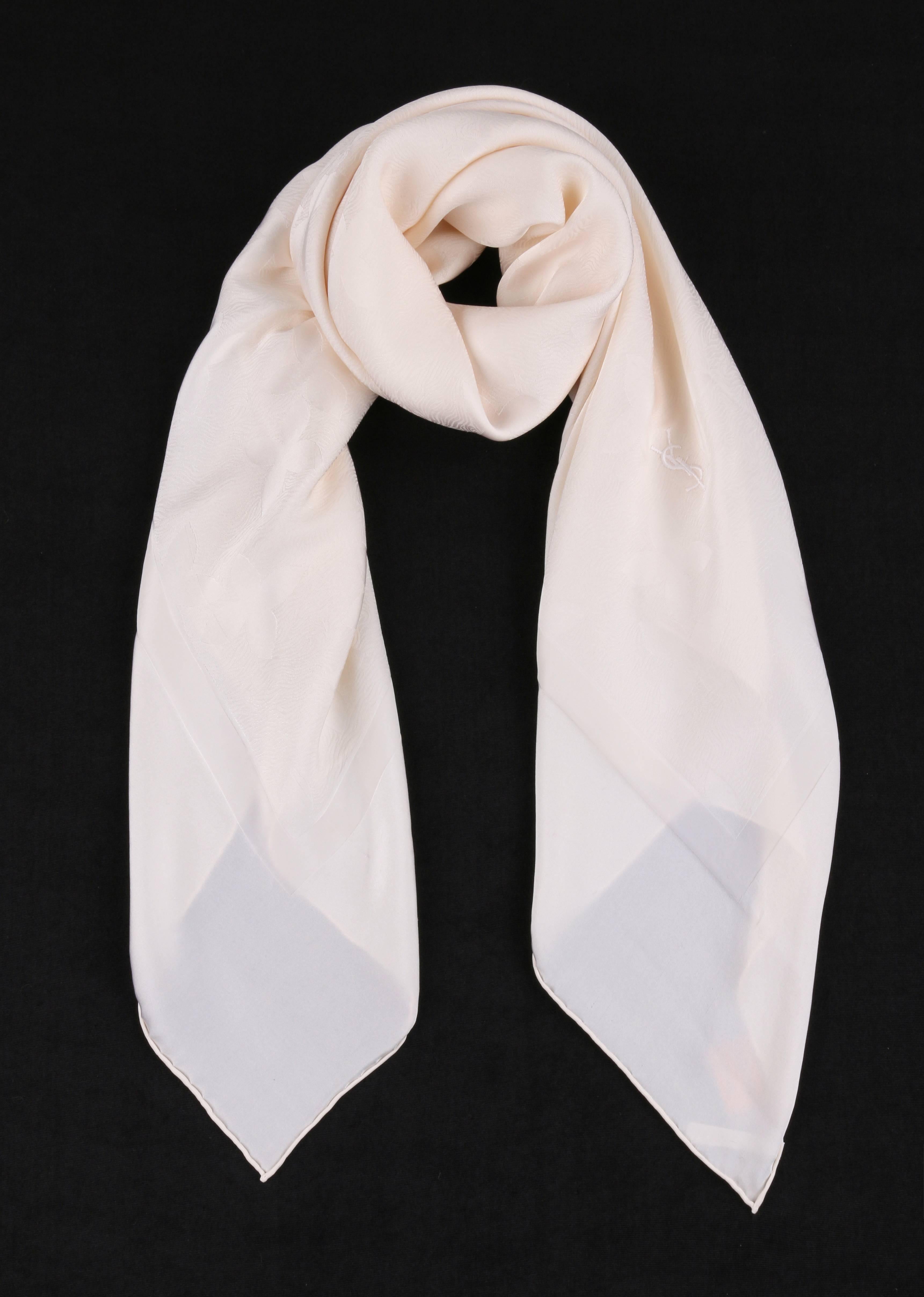 Yves Saint Lauren Fourlards YSL off white floral damask silk scarf / wrap. Solid off white exterior boarder with thin raised interior border. All over floral and striped wood grain motif at center. 