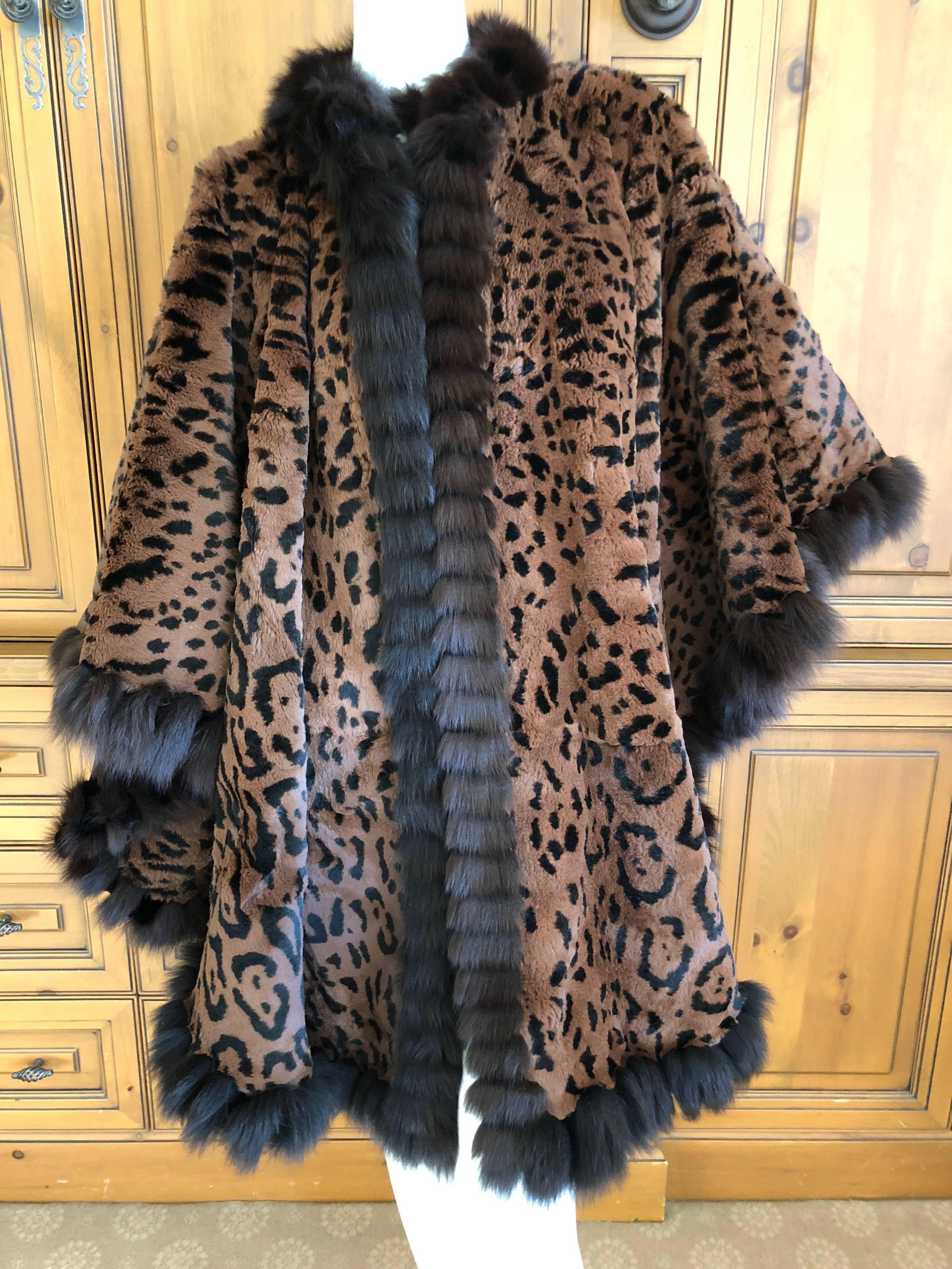 Yves Saint Laurent Fourrures Reversible Huge Swing Cape Sheared Leopard Pattern Fur with Sable Trim.
The sheared fur has a printed leopard pattern and I believe it is sheared Nutria, it was a popular fur for YSL in the eighties.
This is amazing, and