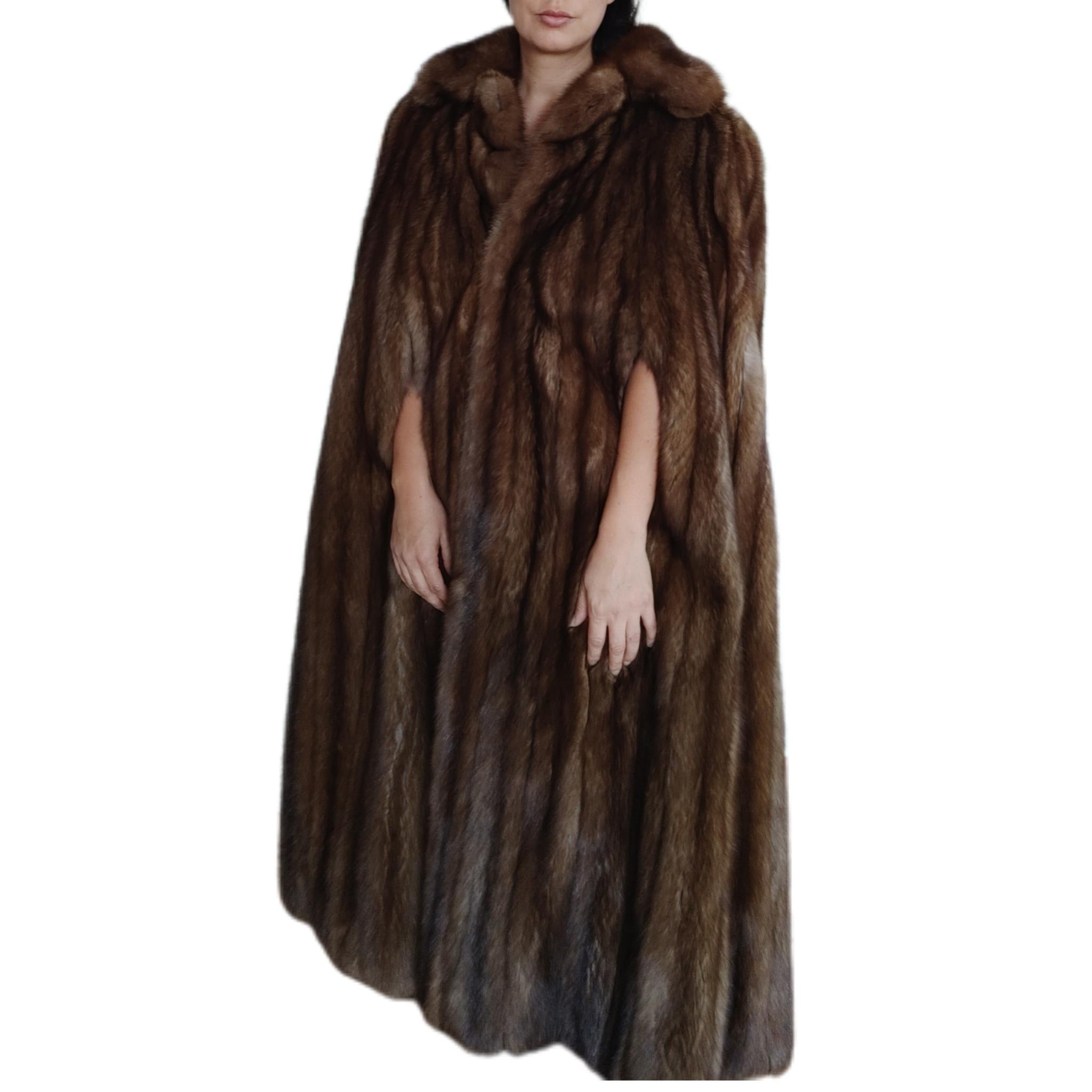  PRODUCT DESCRIPTION:

Brand new luxurious Yves Saint Laurent Fourrures Russian Sable cape with arm slits

Condition: Brand New

Closure: hook and eye 

Color: silver tip 

Material: Russian Sable 

Garment type: Cape

Sleeves: Straight

Pockets: