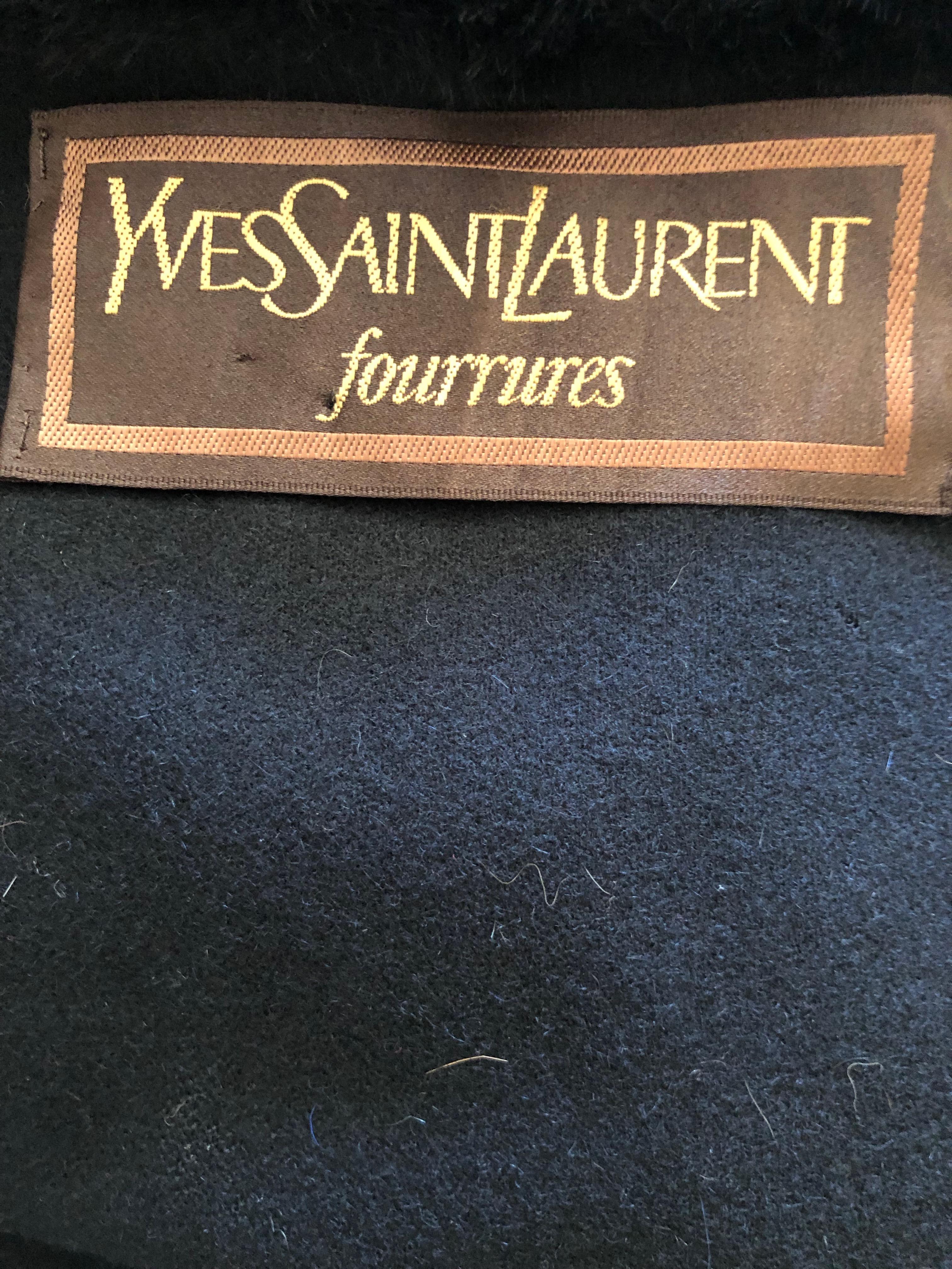 Yves Saint Laurent Fourrures Vintage Black Cashmere Blend Cape with Sheared Beaver Fur Collars and Cuffs.
Feels like cashmere but there is no fabric tag.
In excellent condition.
50