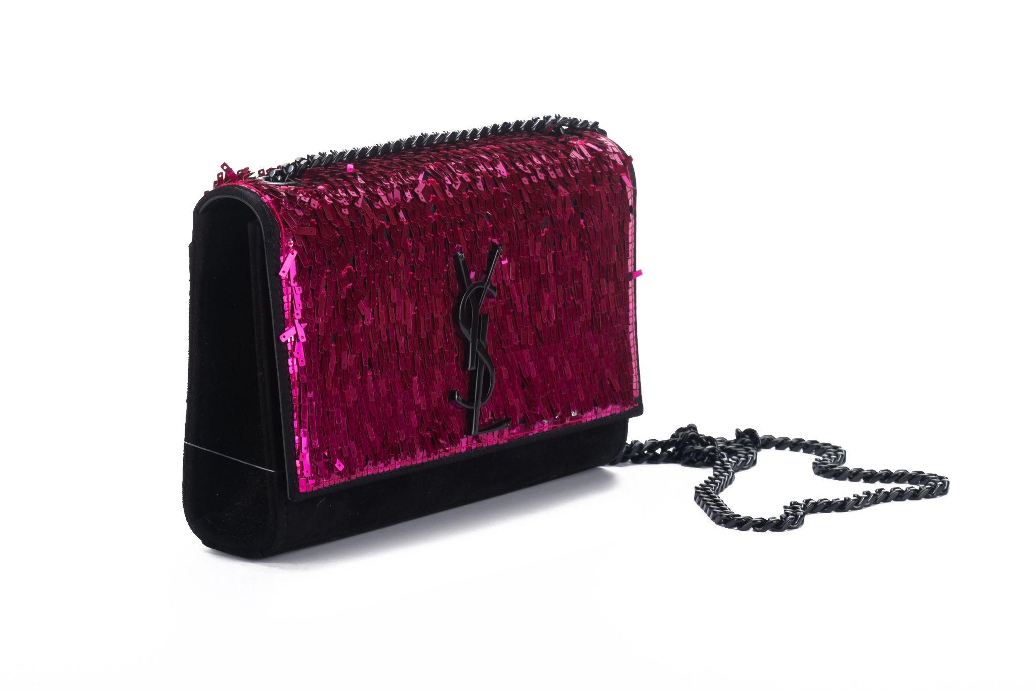 Yves Saint Laurent brand new fuchsia sequins and black suede cross body evening bag. Shoulder drop 22”. Original price 3480$. Comes with booklet and original dust cover.
