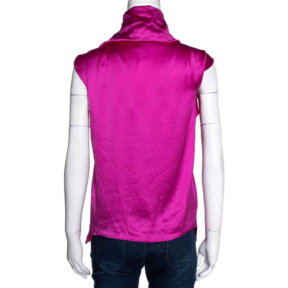 Pair this top from Yves Saint Laurent with your favourite accessories to flaunt a classic style statement. Light up any occasion with your fashion style when you step out wearing this fuschia pink top. Made from premium pure silk fabric, this top