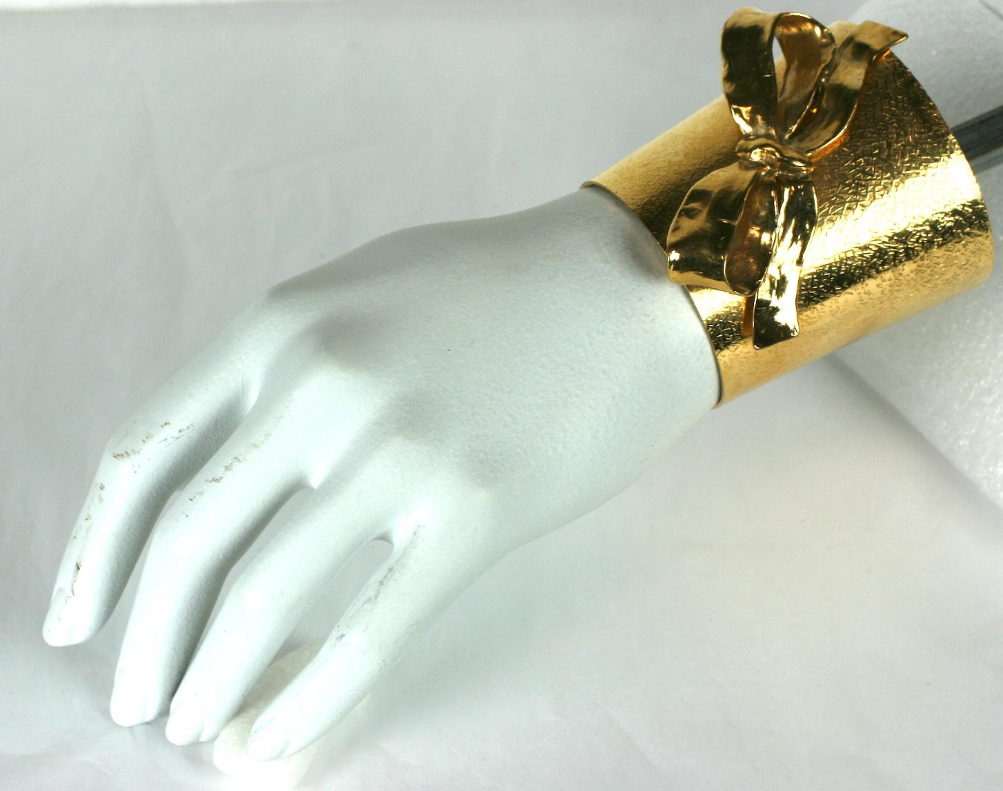 Yves Saint Laurent Gilt Bow Cuff In Excellent Condition For Sale In New York, NY