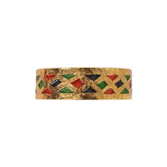 Pulsera Yves Saint Laurent de metal dorado y esmalte