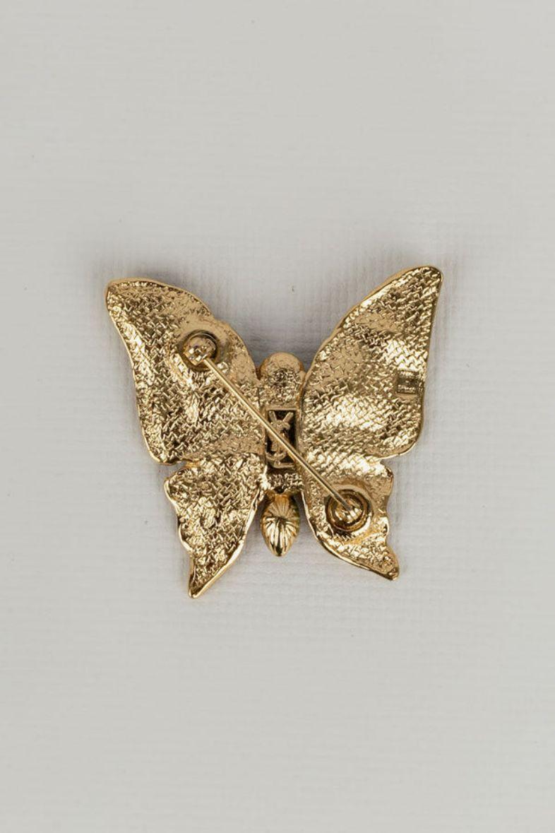 Yves Saint Laurent - (Made in France) Gold metal and rhinestone butterfly brooch from the early 1990's.

Additional information:
Dimensions: 5 cm x 5 cm
Condition: Very good condition
Seller Ref number: BR59