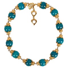 Yves Saint Laurent, collier en métal plaqué or avec perles en bois