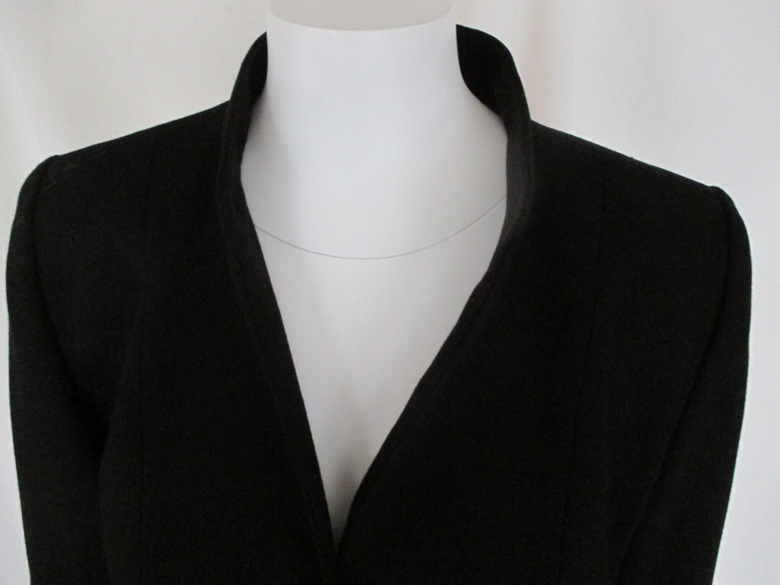 Vintage YSL black jacket with 3 gold color sun buttons at front and sleeves.
no pockets, 100% wool.
Size Appears to be France 42 and US 10, please refer to the measurements in the description.
Please note that vintage items are not new and therefore