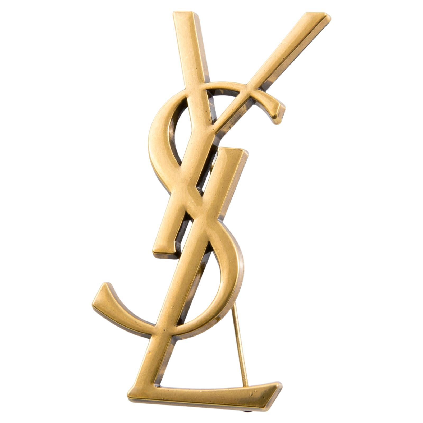 Yves Saint Laurent Broche YSL Cassandre grande dorado