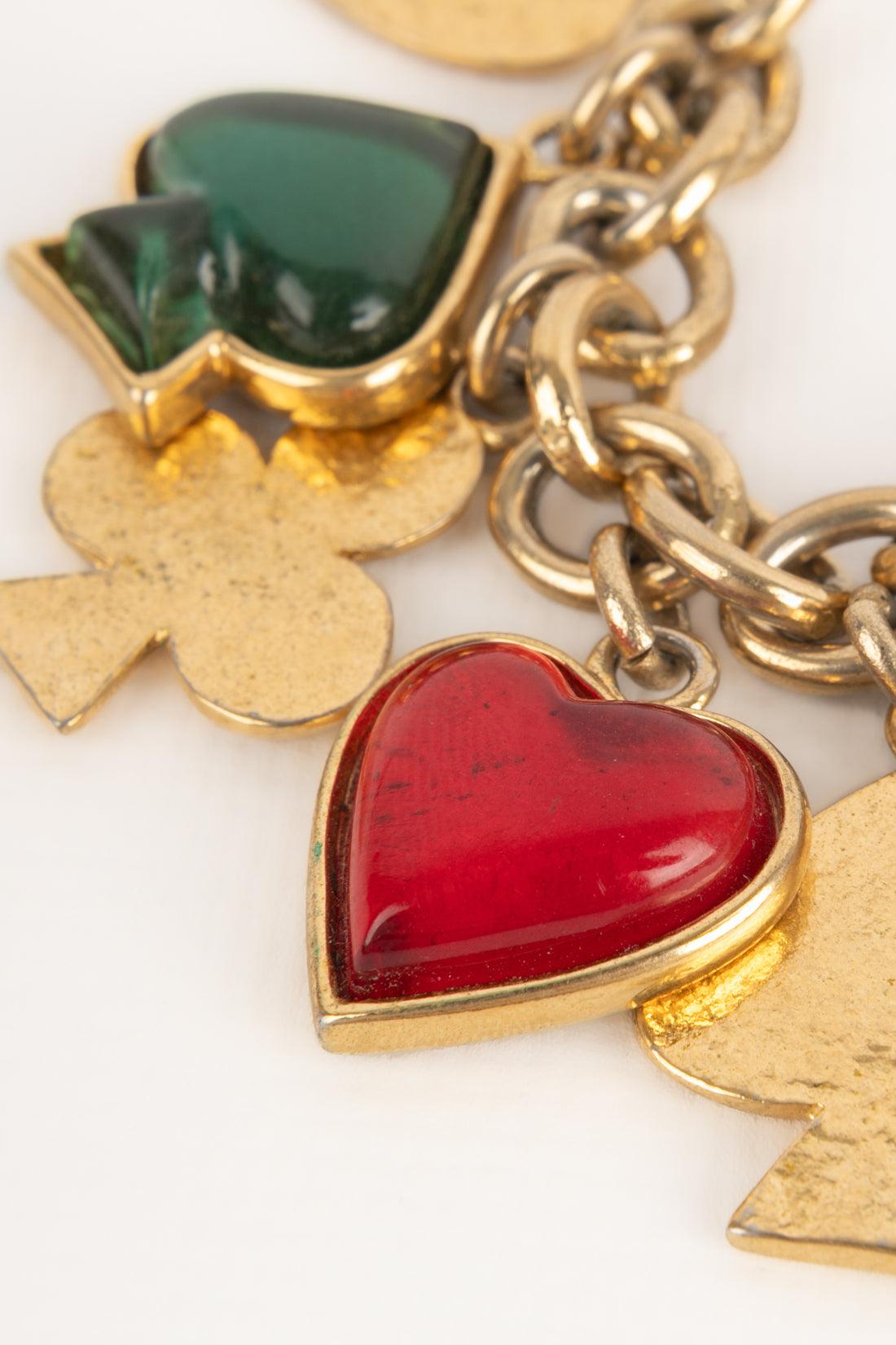 Donna Bracciale con charme in metallo dorato Yves Saint Laurent in vendita