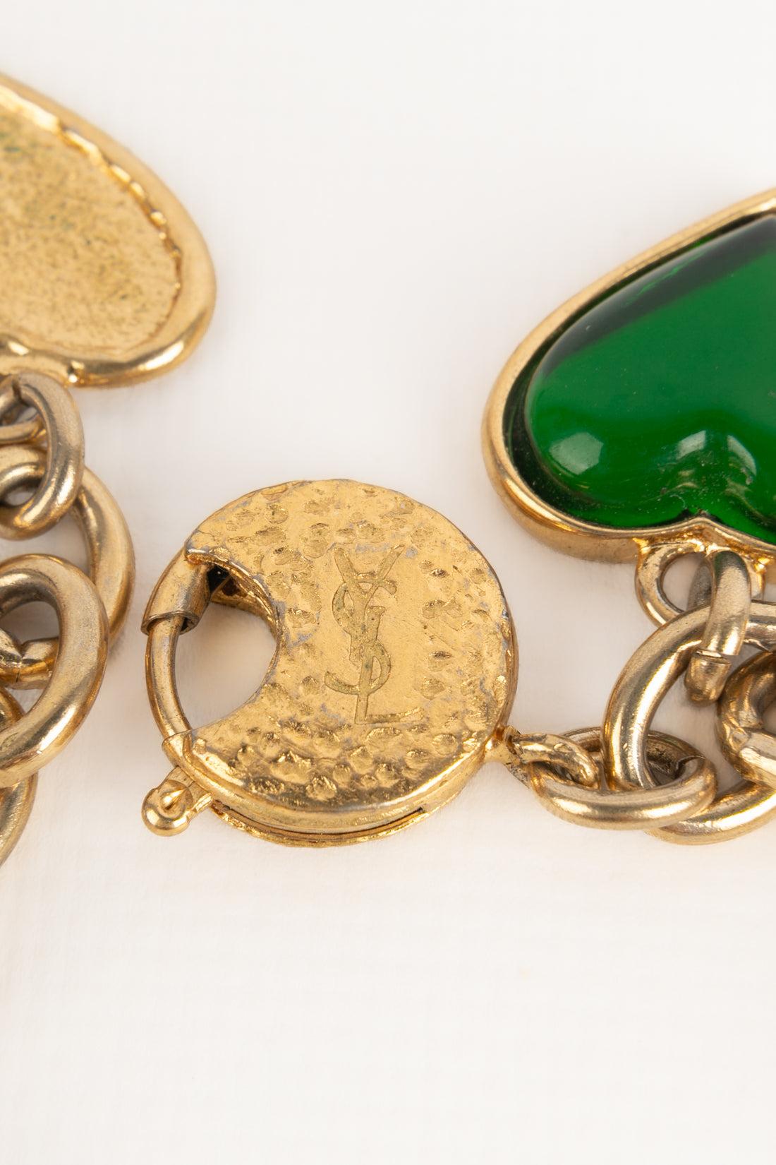 Bracciale con charme in metallo dorato Yves Saint Laurent in vendita 1