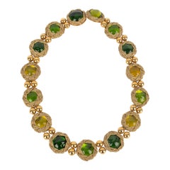 Collana Yves Saint Laurent in metallo dorato con cabochon in resina verde e gialla