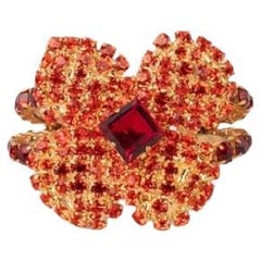 Yves Saint Laurent Bracciale rigido a fiori in metallo dorato