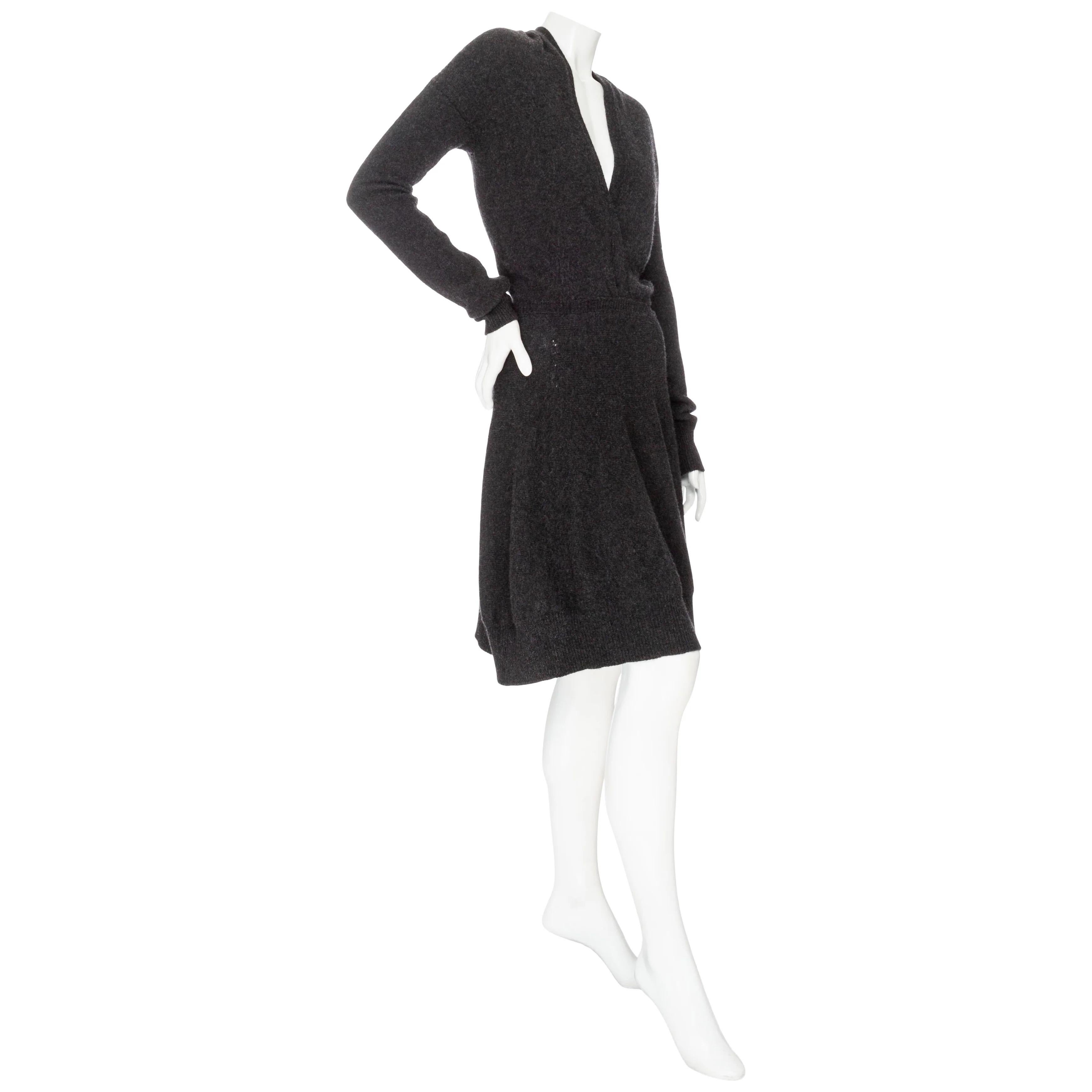Yves Saint Laurent Gray Cashmere Knit V-Neck Dress 

Dark Gray
Long sleeve
Surplice bodice
Deep V-neckline (no closure)
Banded waist
Ribbed trim
Crisscross stitching on skirt
A-line silhouette
Knee-length
Pull on
Made in Italy
No fabric composition